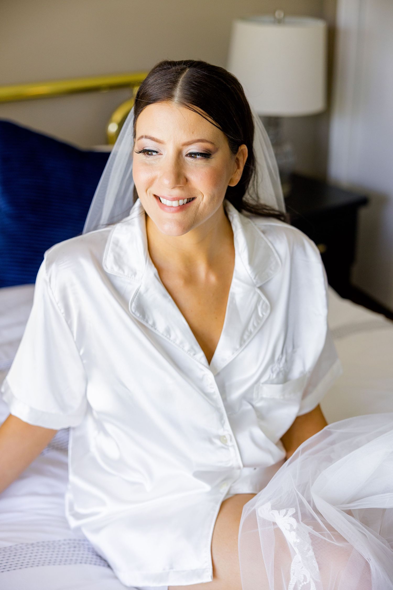 Getting ready wedding morning scene in a white robe.