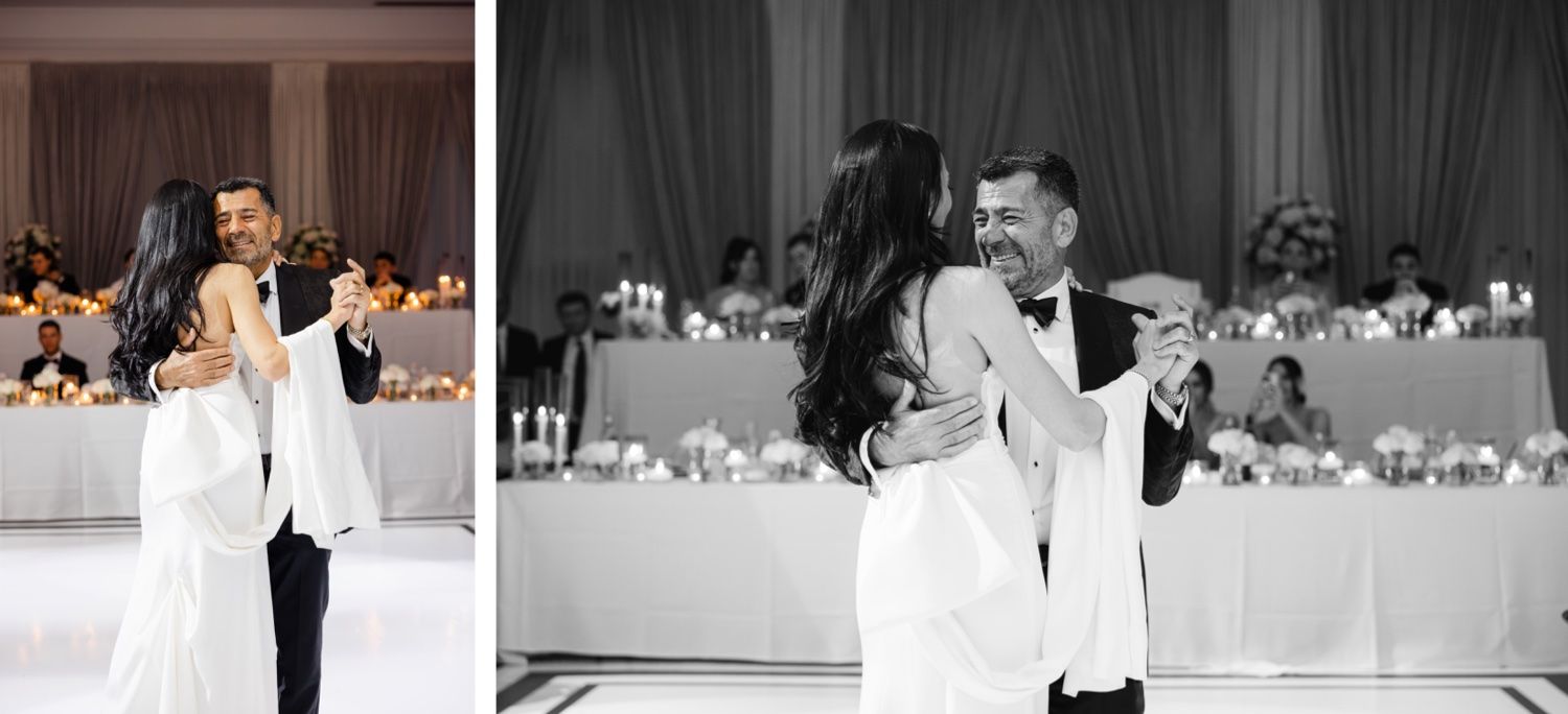 Elegant couple dancing at their wedding reception with guests seated at decorated tables in background.