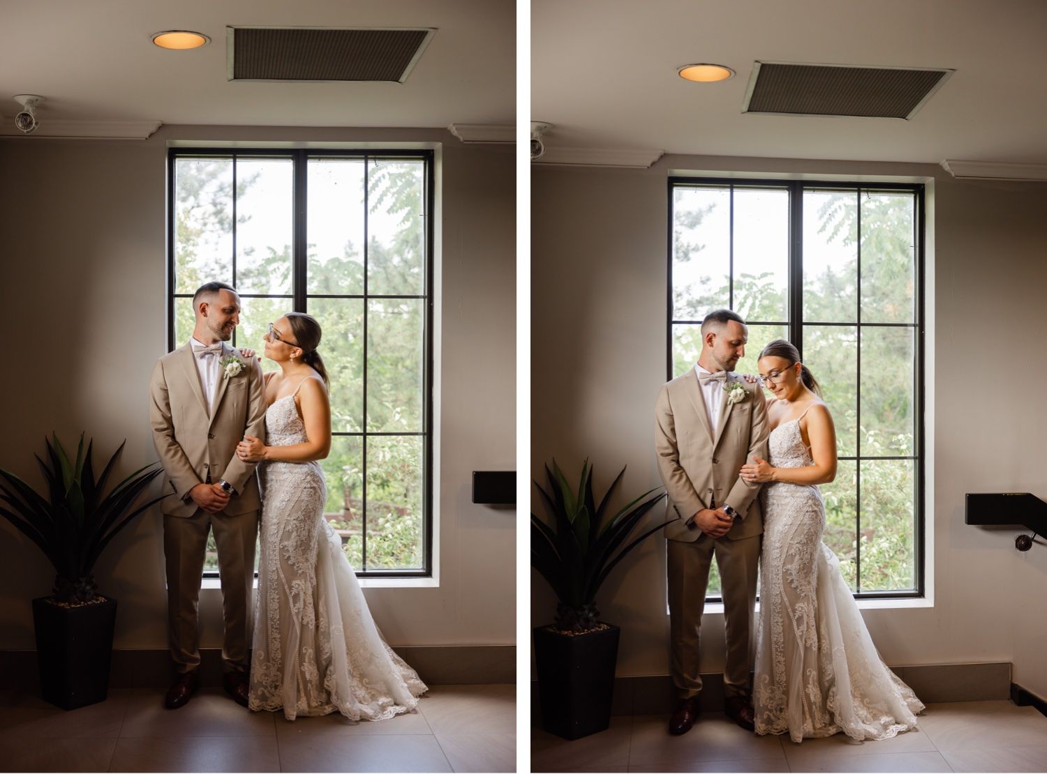 Wedding couple posing by large window in elegant indoor setting.