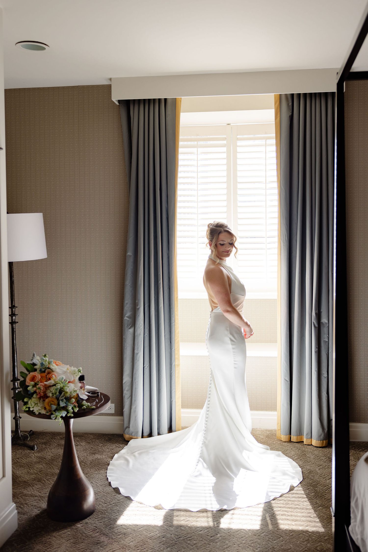 Multiple angles of a bridal dress captured in a modern room with blue curtains and natural lighting.