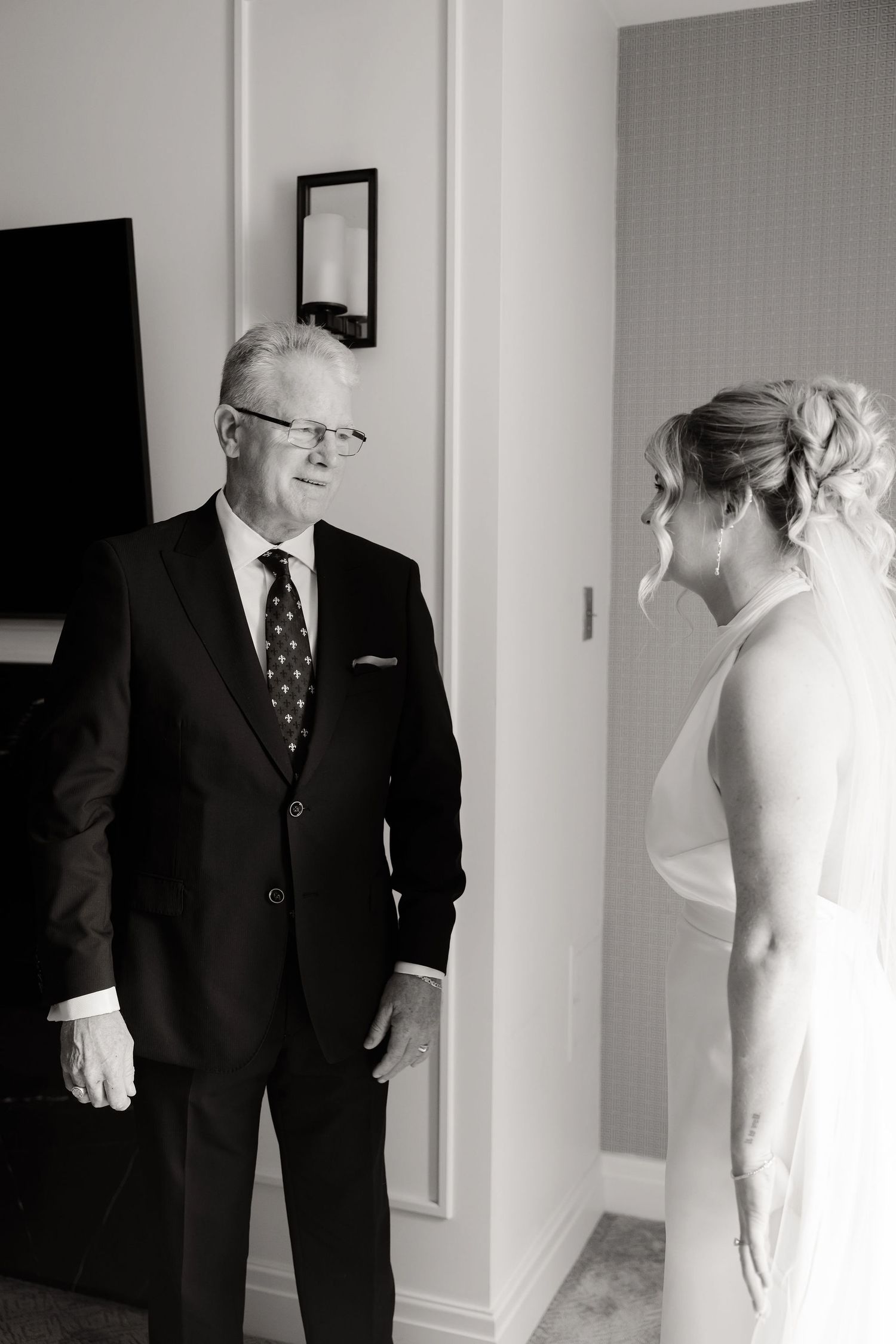 Black and white series capturing a touching pre-wedding reveal moment.