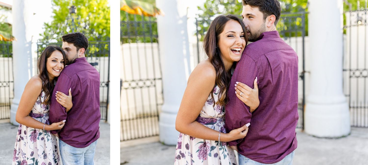 Joyful couple sharing laughs and embraces during outdoor photo session.