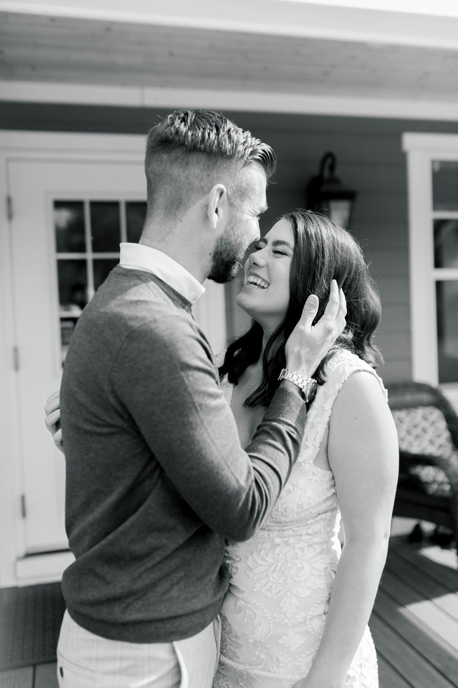 Black and white intimate portrait on outdoor porch.