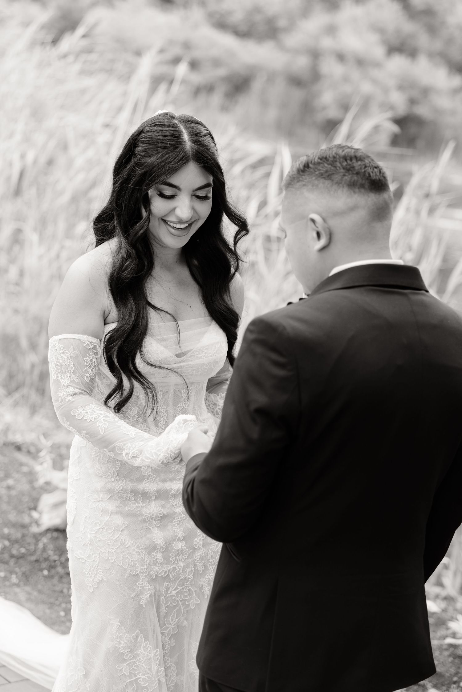 Black and white photos of a bride and groom sharing sweet moments during an outdoor wedding photography session.