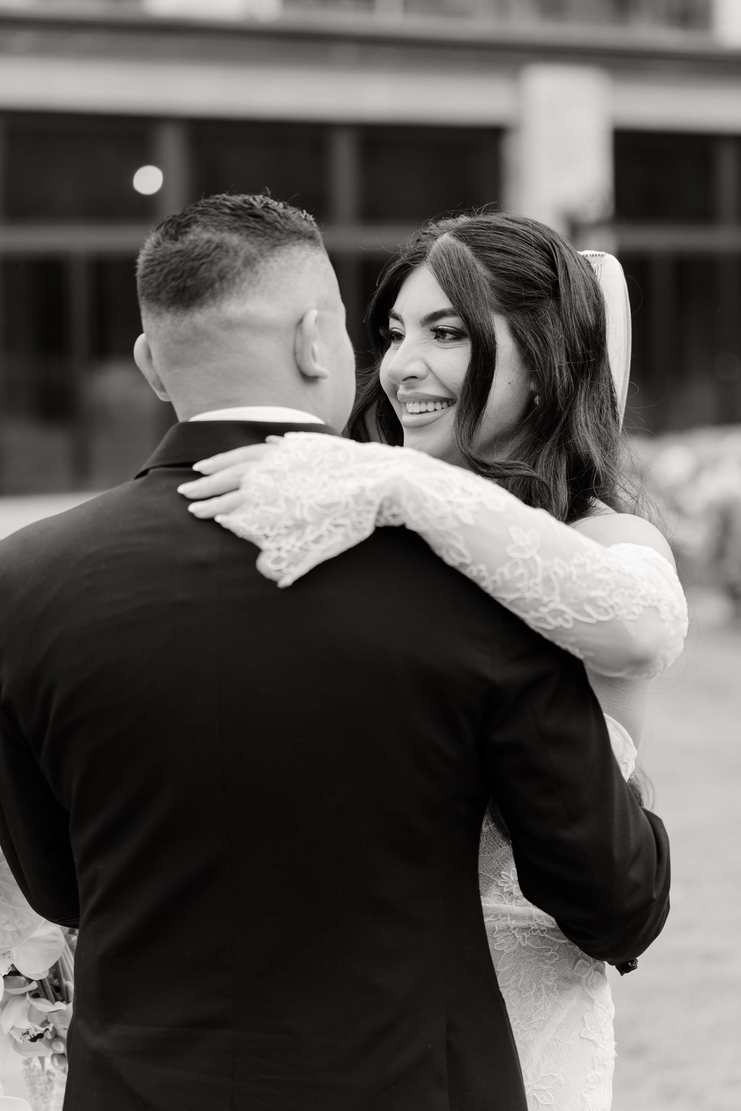 Black and white romantic sequence of a couple sharing a tender moment during their wedding celebration.