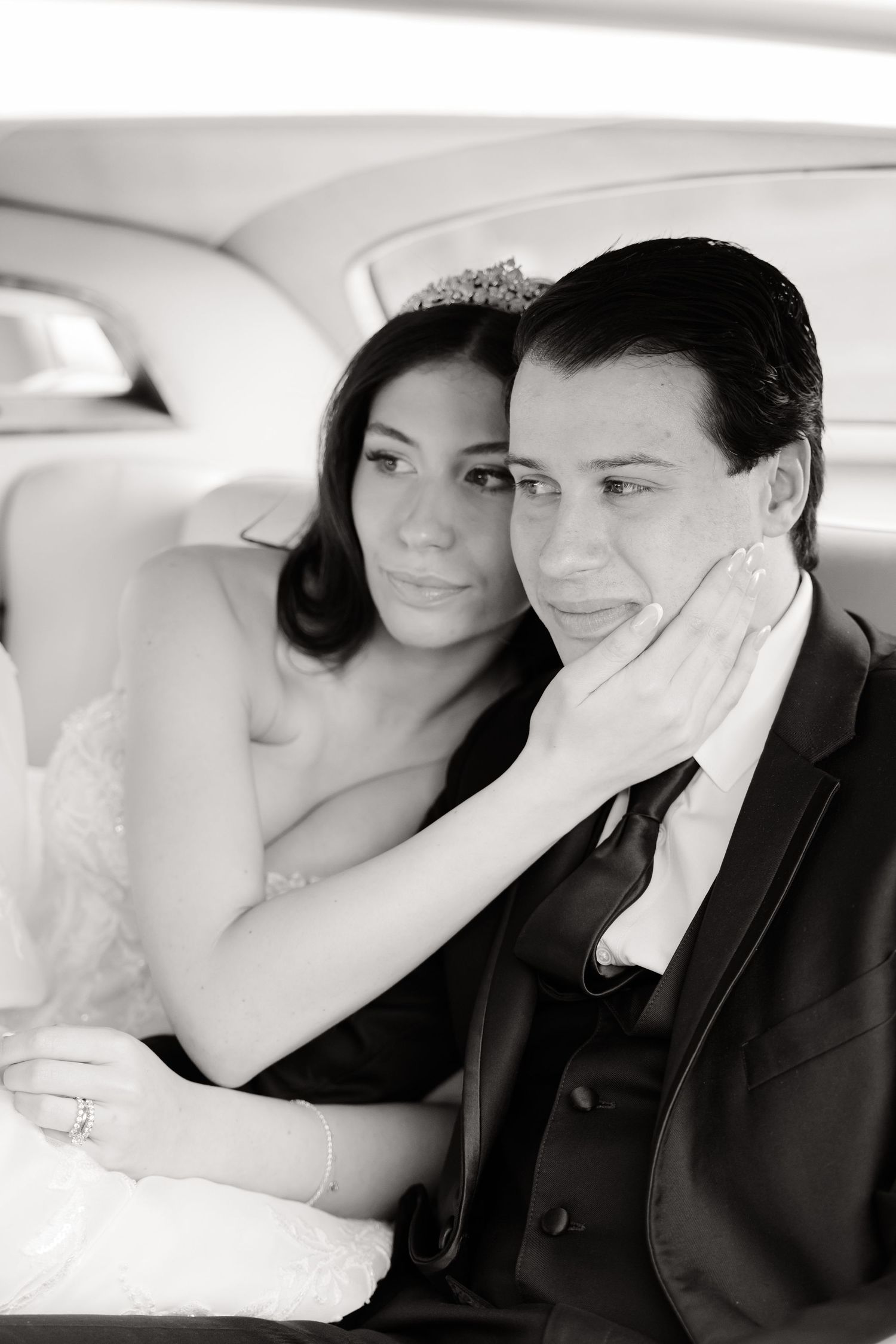 A romantic black and white photo series showing a couple in formal wedding attire sharing intimate moments together.