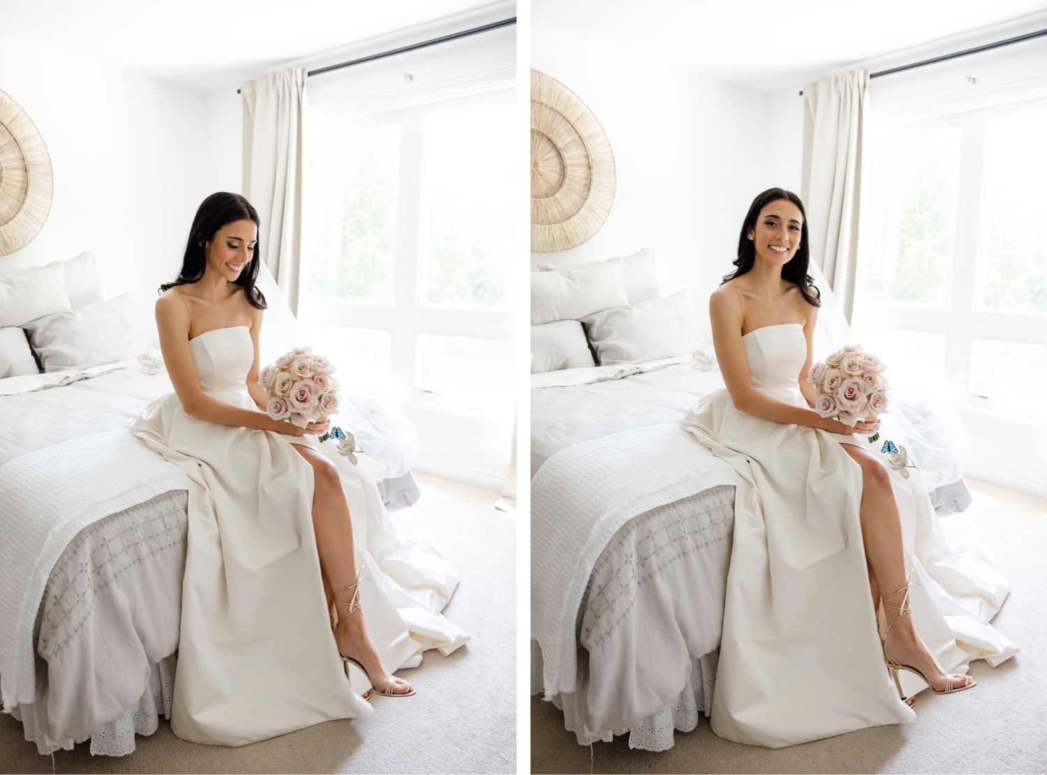 Bride in elegant white wedding gown sits holding pink rose bouquet in bright room.