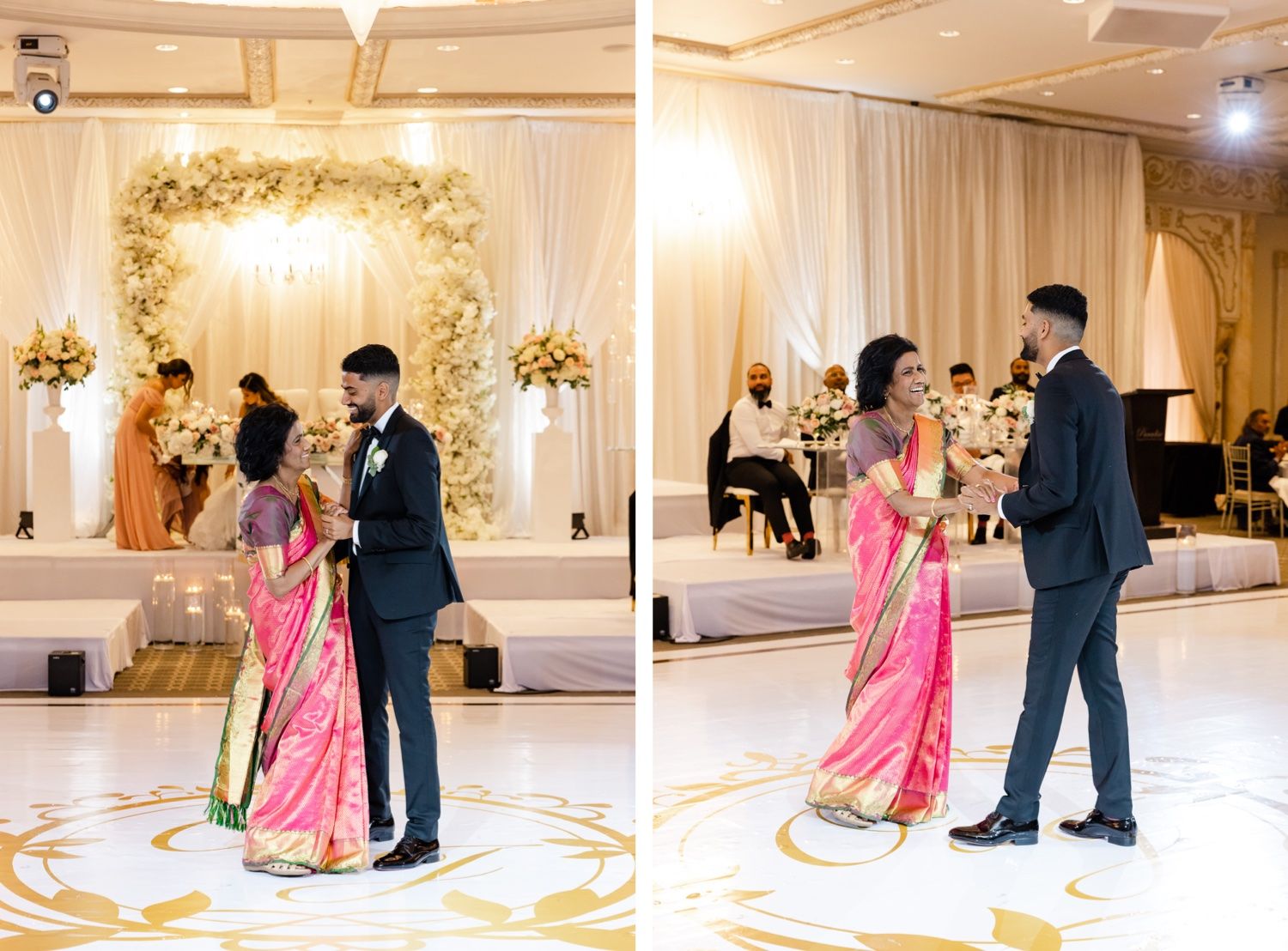 Couple dances together at their wedding reception under an elegant floral arch with white and gold decor.