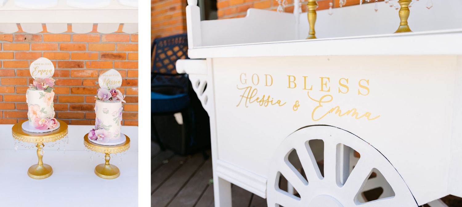 Elegant wedding cakes displayed on gold stands with delicate floral decorations against a brick wall backdrop.