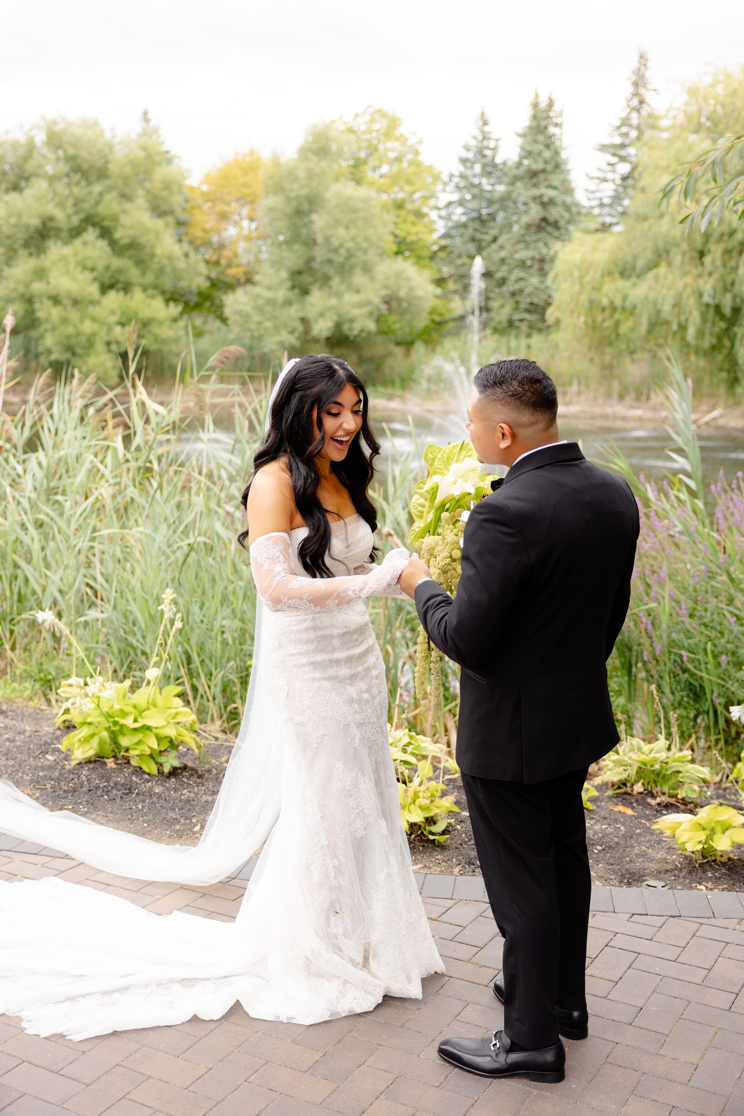 A romantic wedding sequence shows a couple dancing and twirling together in an outdoor garden setting with lush greenery.