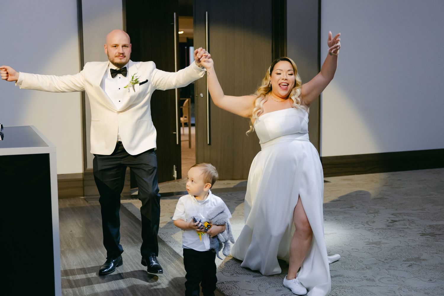 Wedding celebration with joyful moment in modern venue setting.