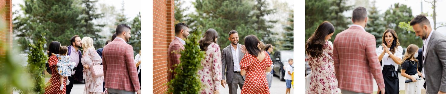 A group of people socializing and mingling outside a church entrance.