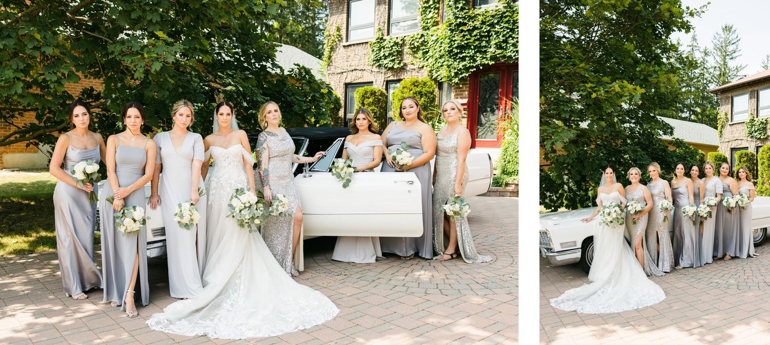 Wedding party group shot with bridesmaids in silver gowns alongside a vintage white car.