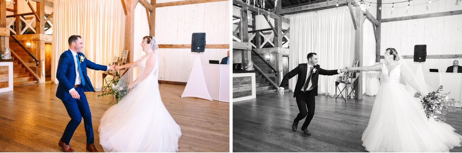 Wedding couple dances energetically in a rustic barn venue with cream colored drapes.
