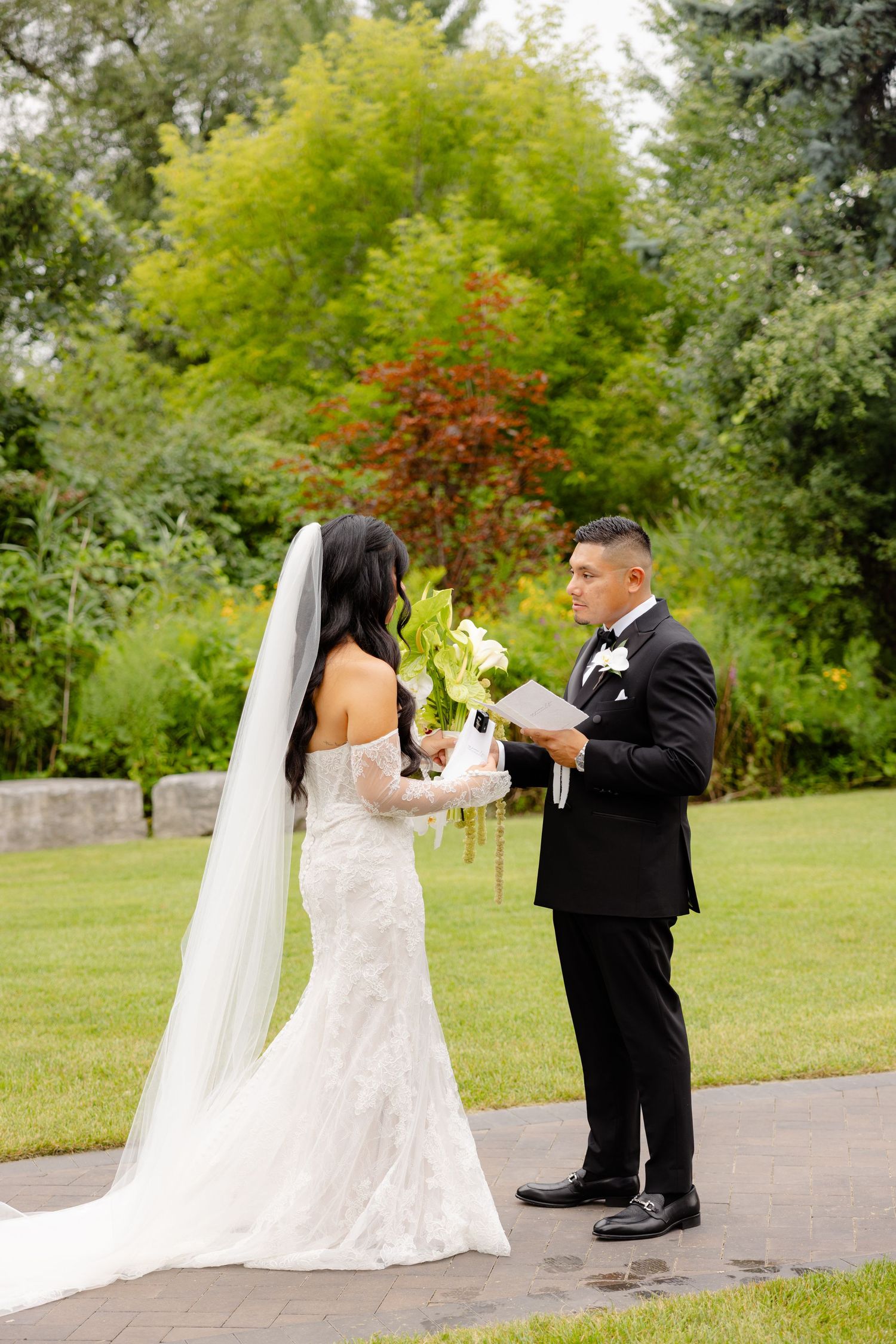 A couple reading their vows during an outdoor wedding ceremony in a lush garden setting, captured in sequence.