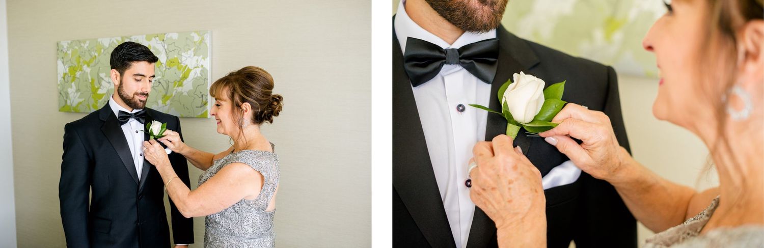 A boutonniere being pinned to a formal black tuxedo lapel during wedding preparations.