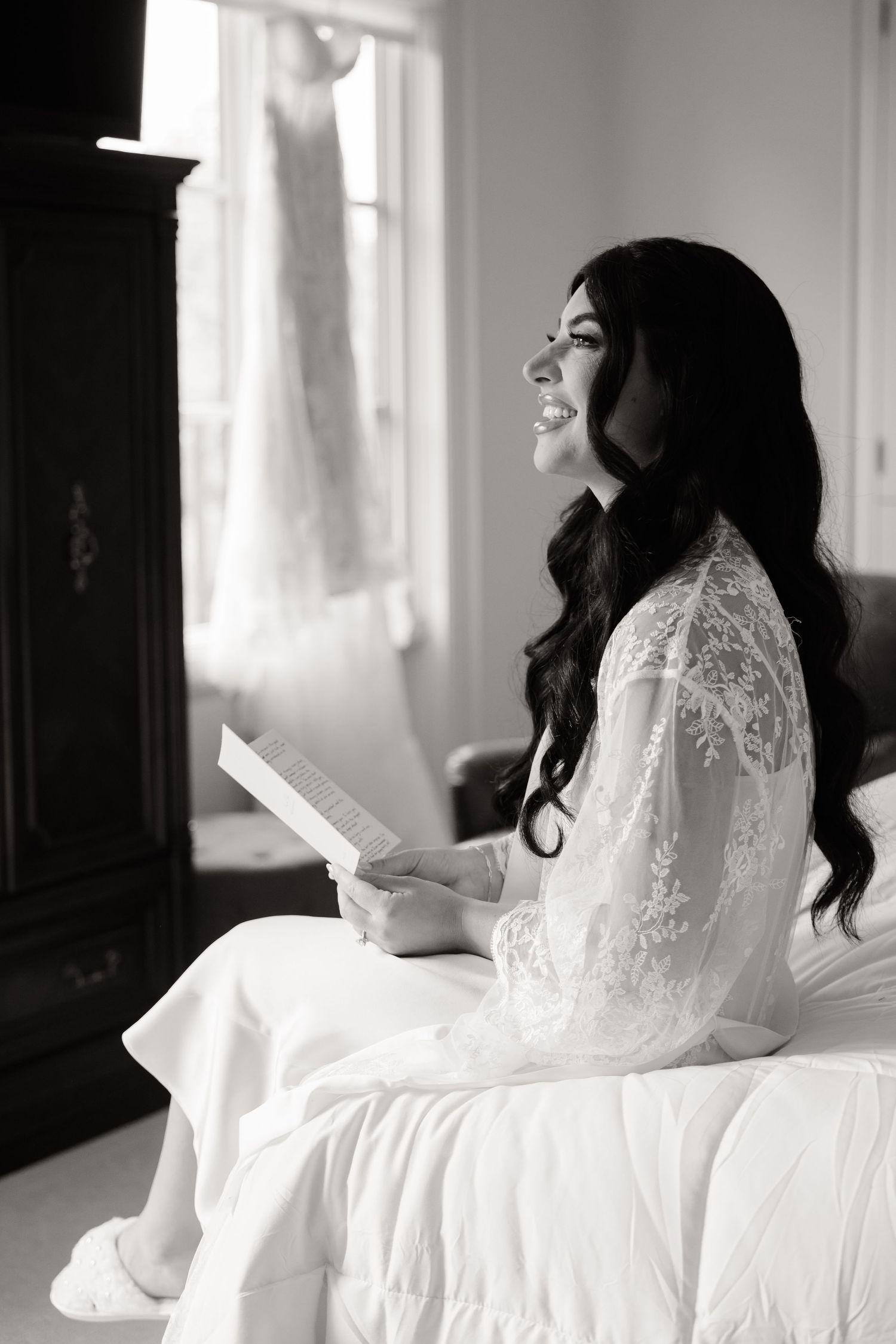 A series of dreamy black and white boudoir photos showing a woman in white lace looking thoughtfully towards window light.