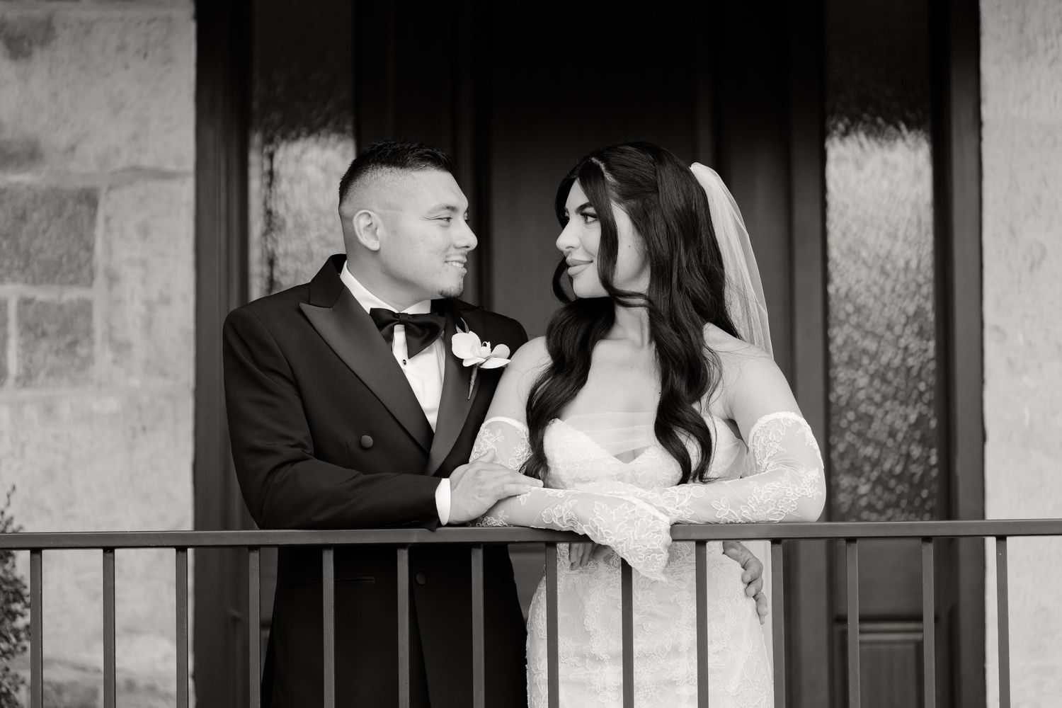 A series of black and white wedding photographs showing tender moments between a bride and groom at their reception.