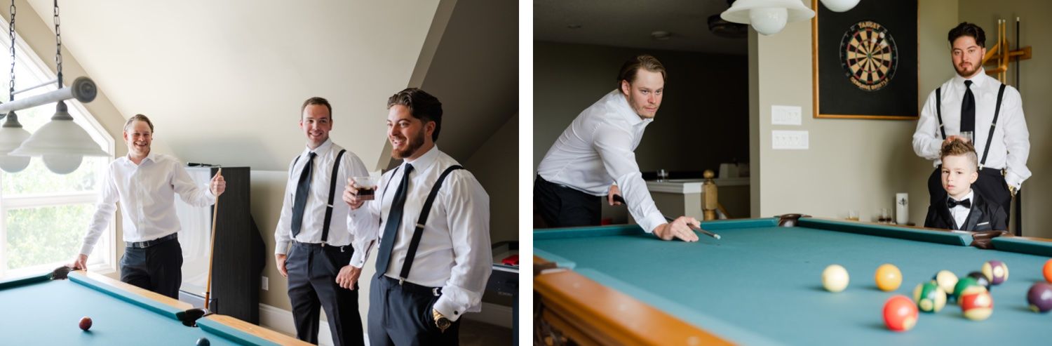 Two people playing pool in a game room with a dartboard visible in the background.
