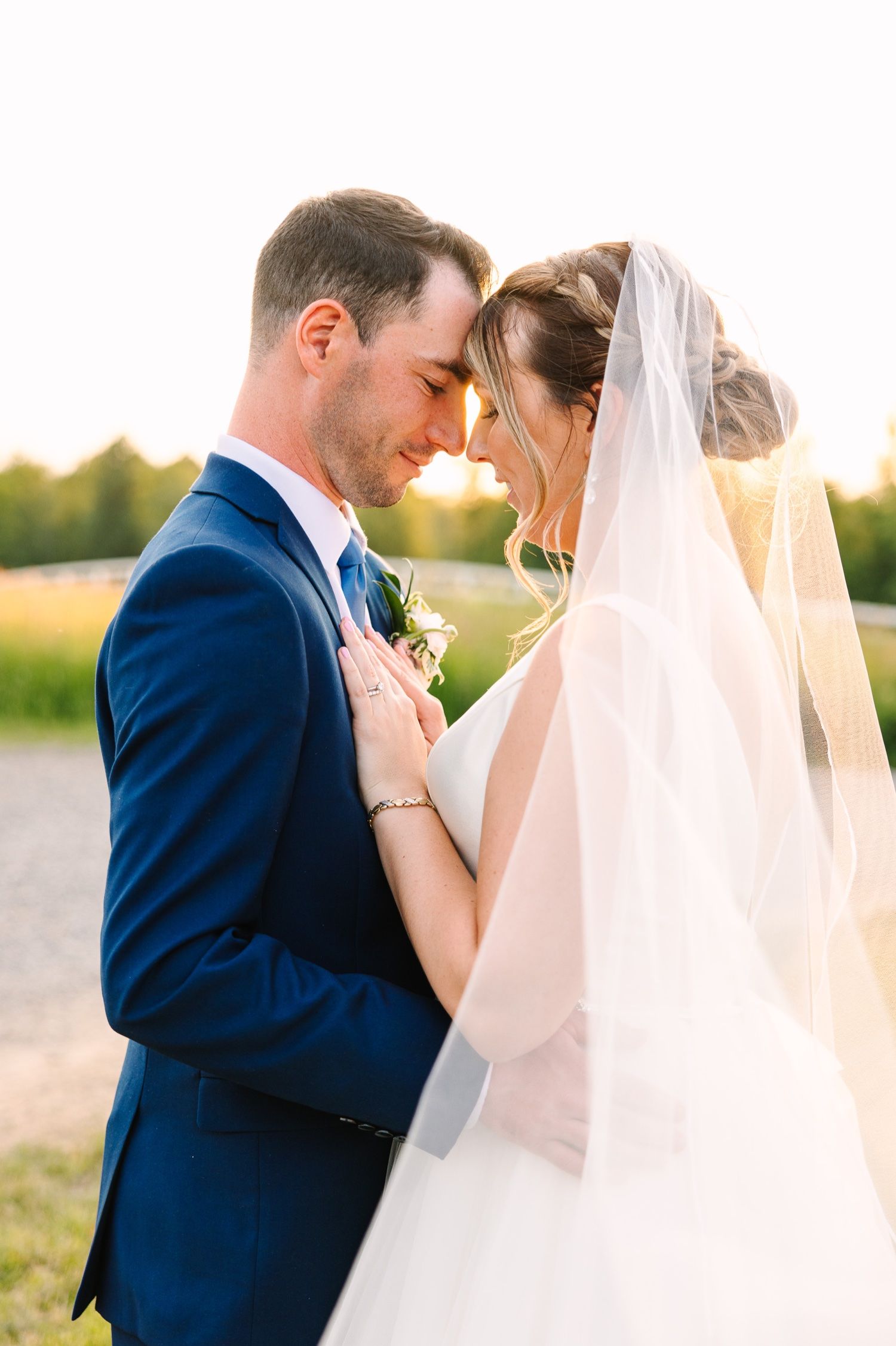 Intimate moment captured between couple during golden hour outdoor portrait session.