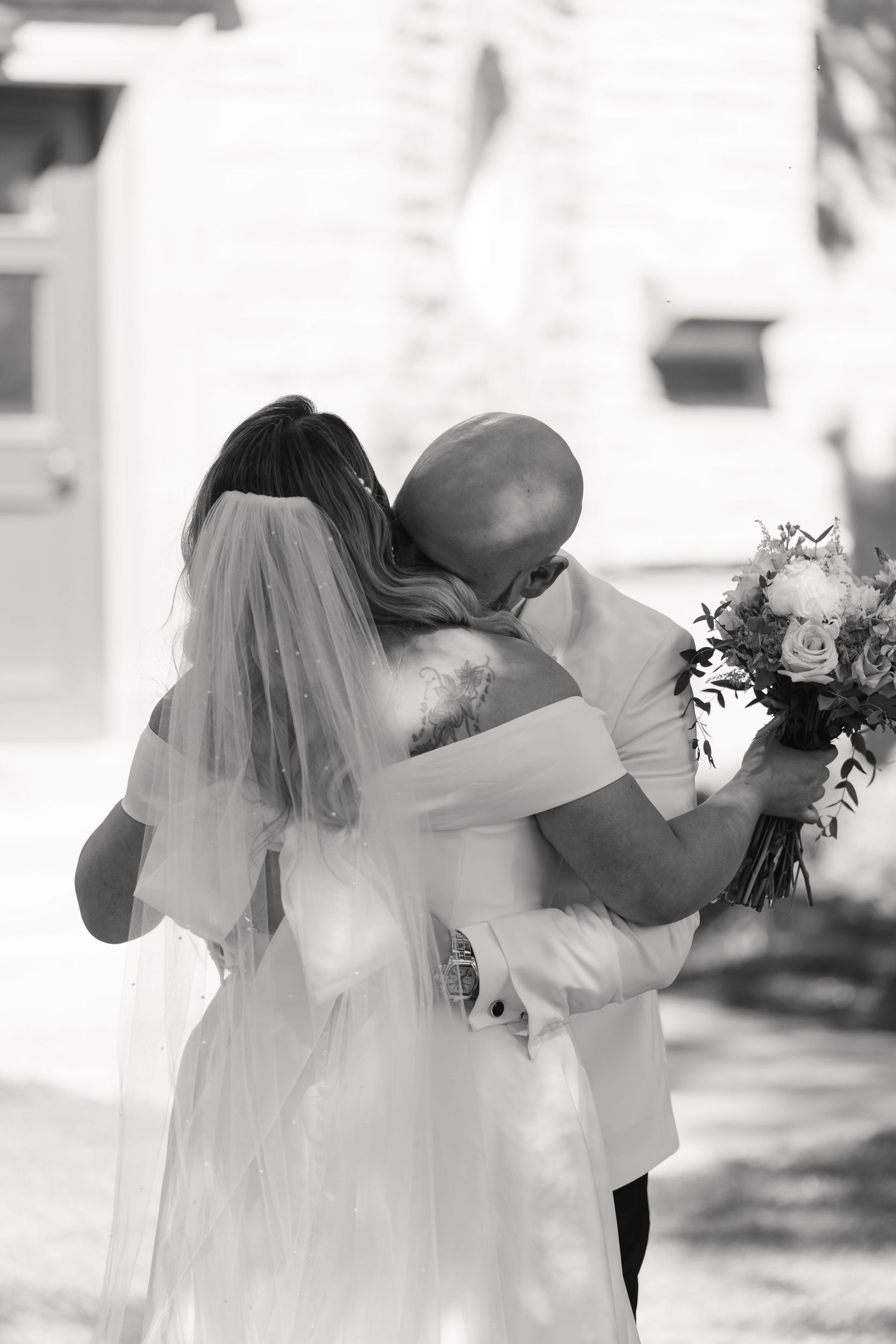Joyful wedding couple sharing excited reactions during outdoor ceremony.