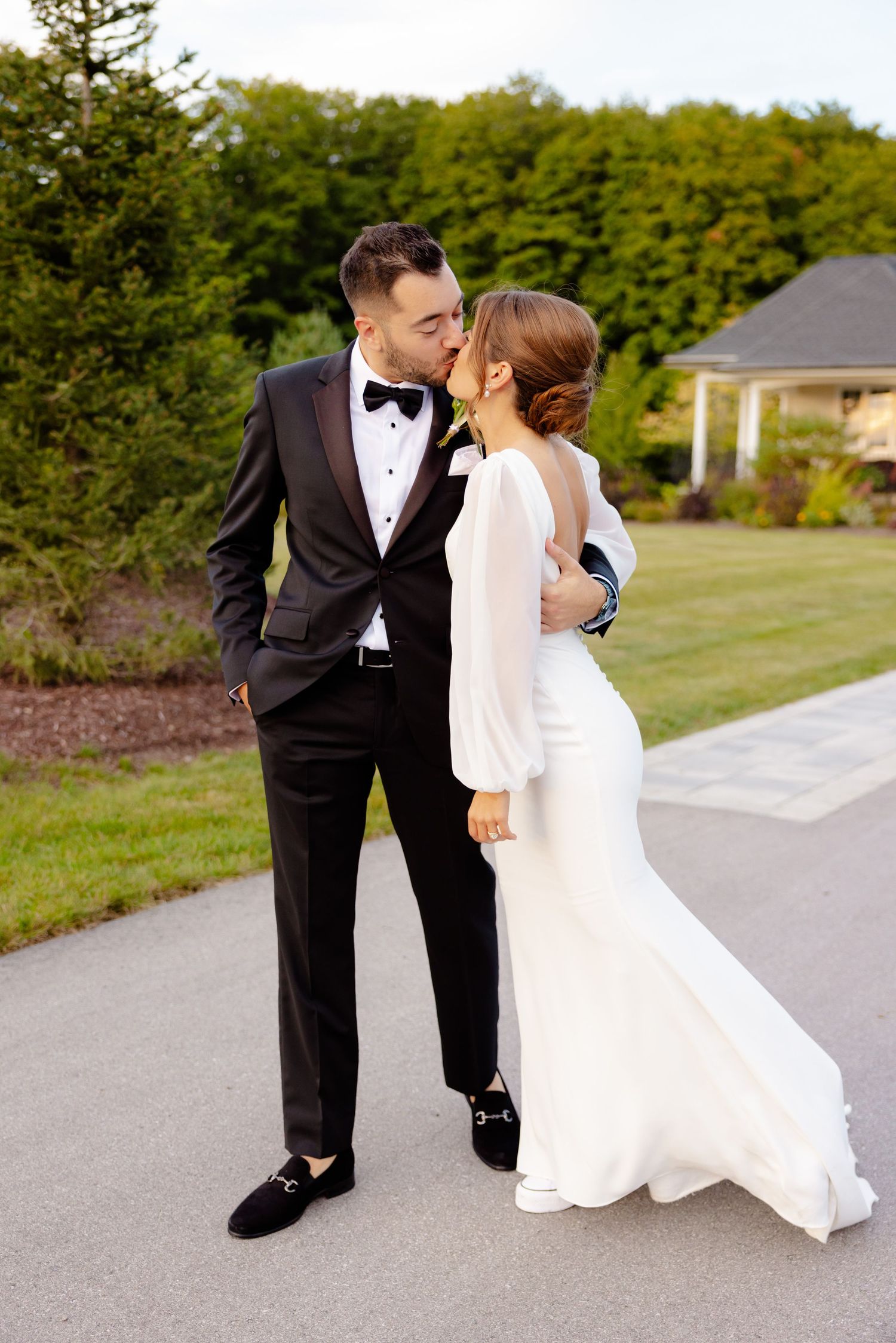 A romantic moment between newlyweds sharing an intimate moment on their wedding day.
