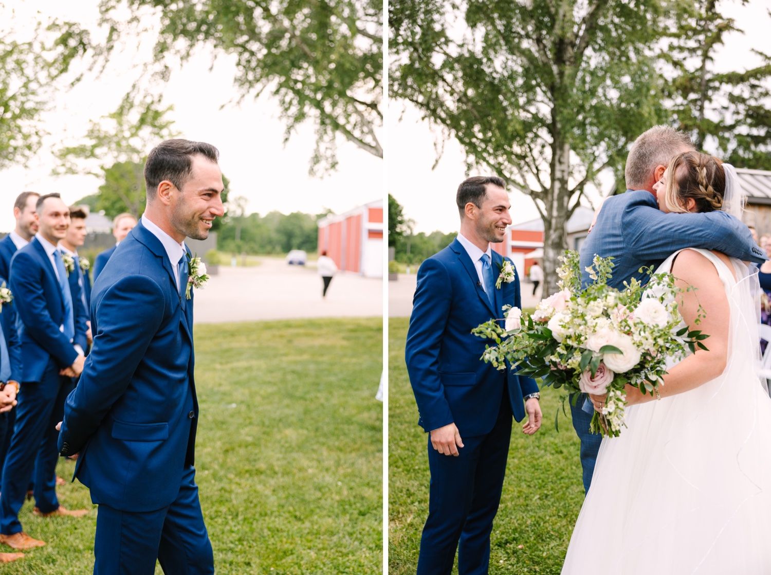 Wedding party members in navy suits and white dresses gather for outdoor celebration.