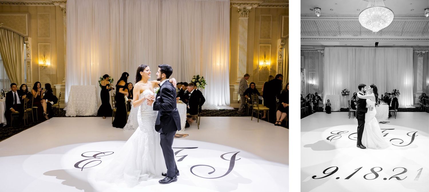 A couple shares their first dance on an elegant white dance floor with wedding monogram details and guests watching.