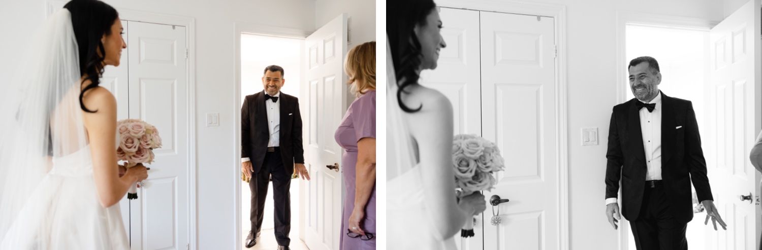 First look moment captured in doorway with bride holding pink bouquet.
