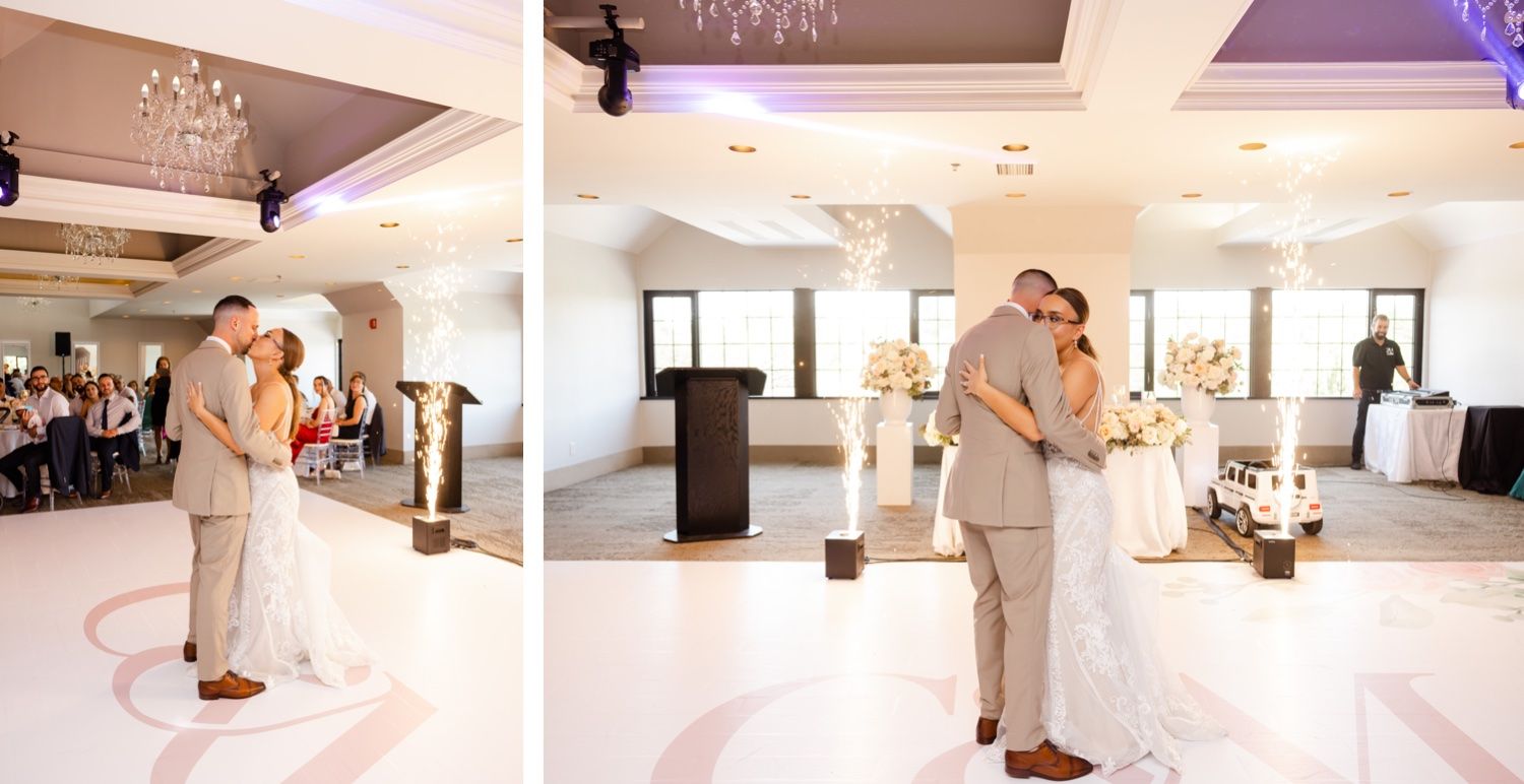 Wedding couple's first dance in an elegant ballroom with white dance floor and soft lighting.