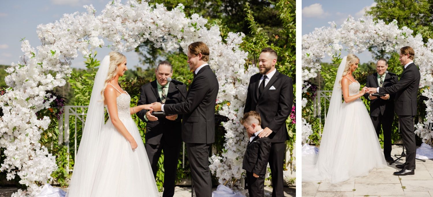 Wedding ceremony moments captured under a beautiful white floral arch on a sunny day.