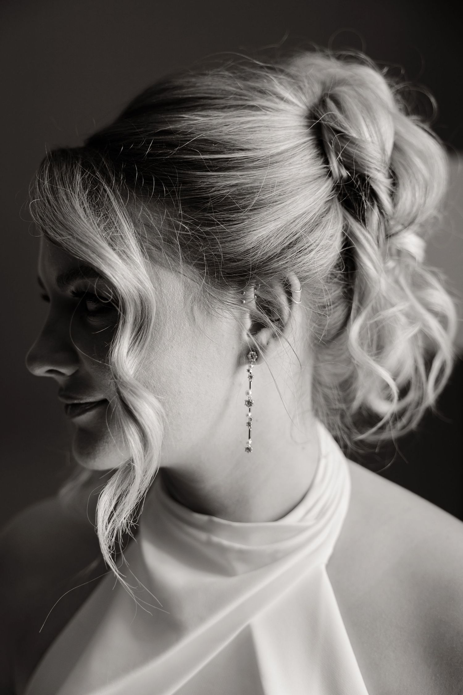 Artistic black and white close-up details of bridal hair and jewelry.
