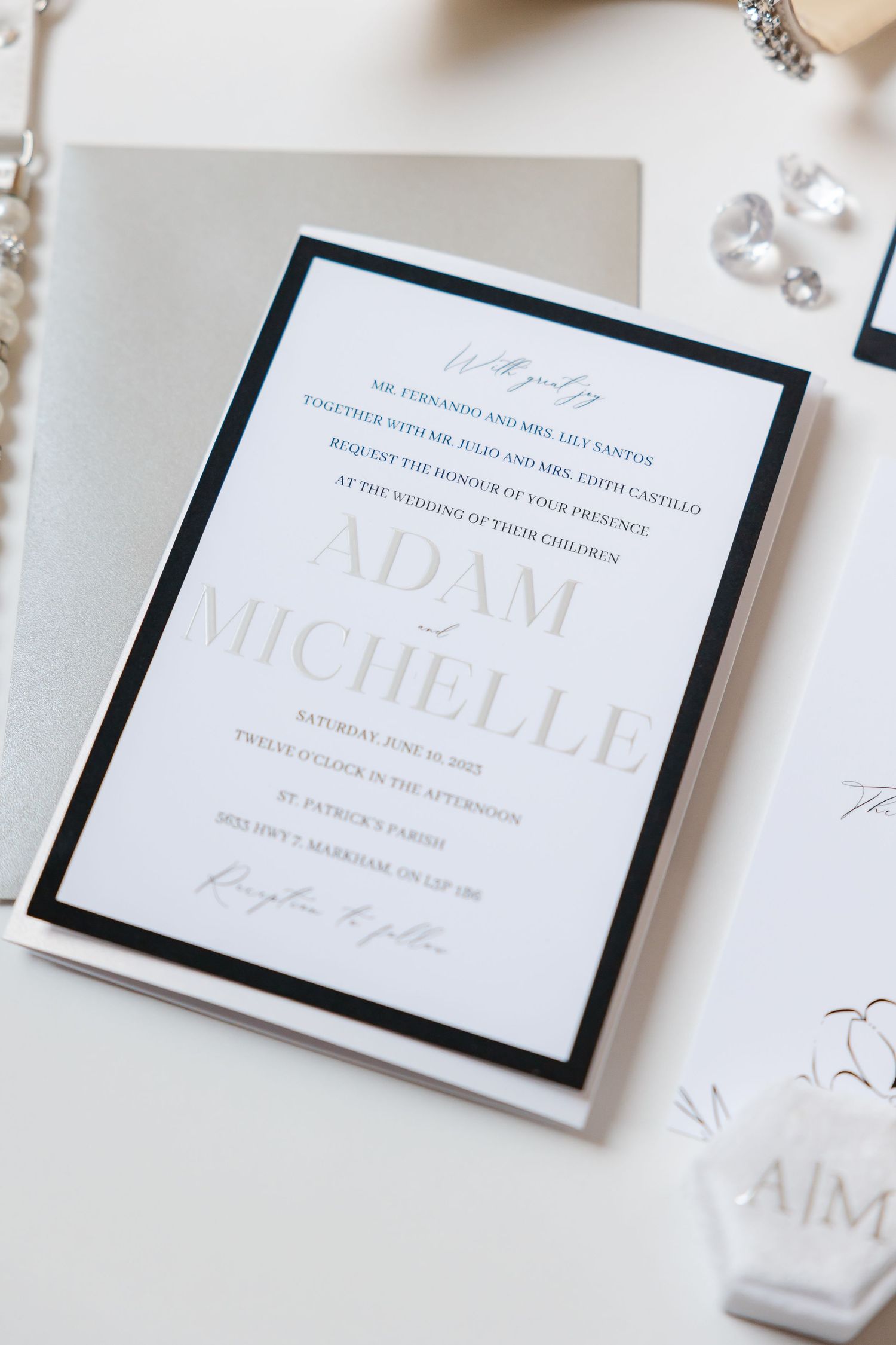 Elegant wedding invitation featuring minimalist typography and black border design.