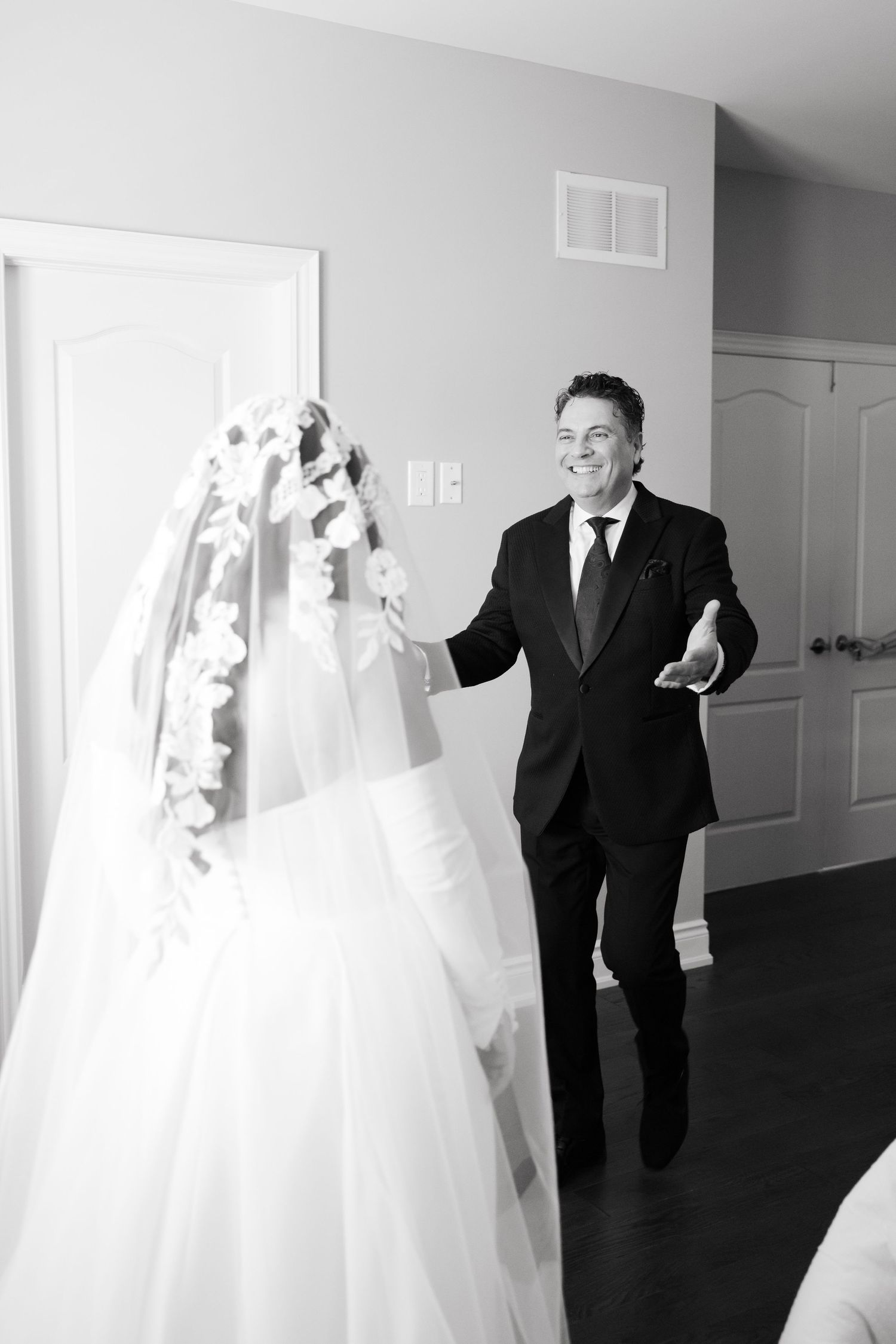 A first look moment captured in black and white as a couple meets before their wedding ceremony.