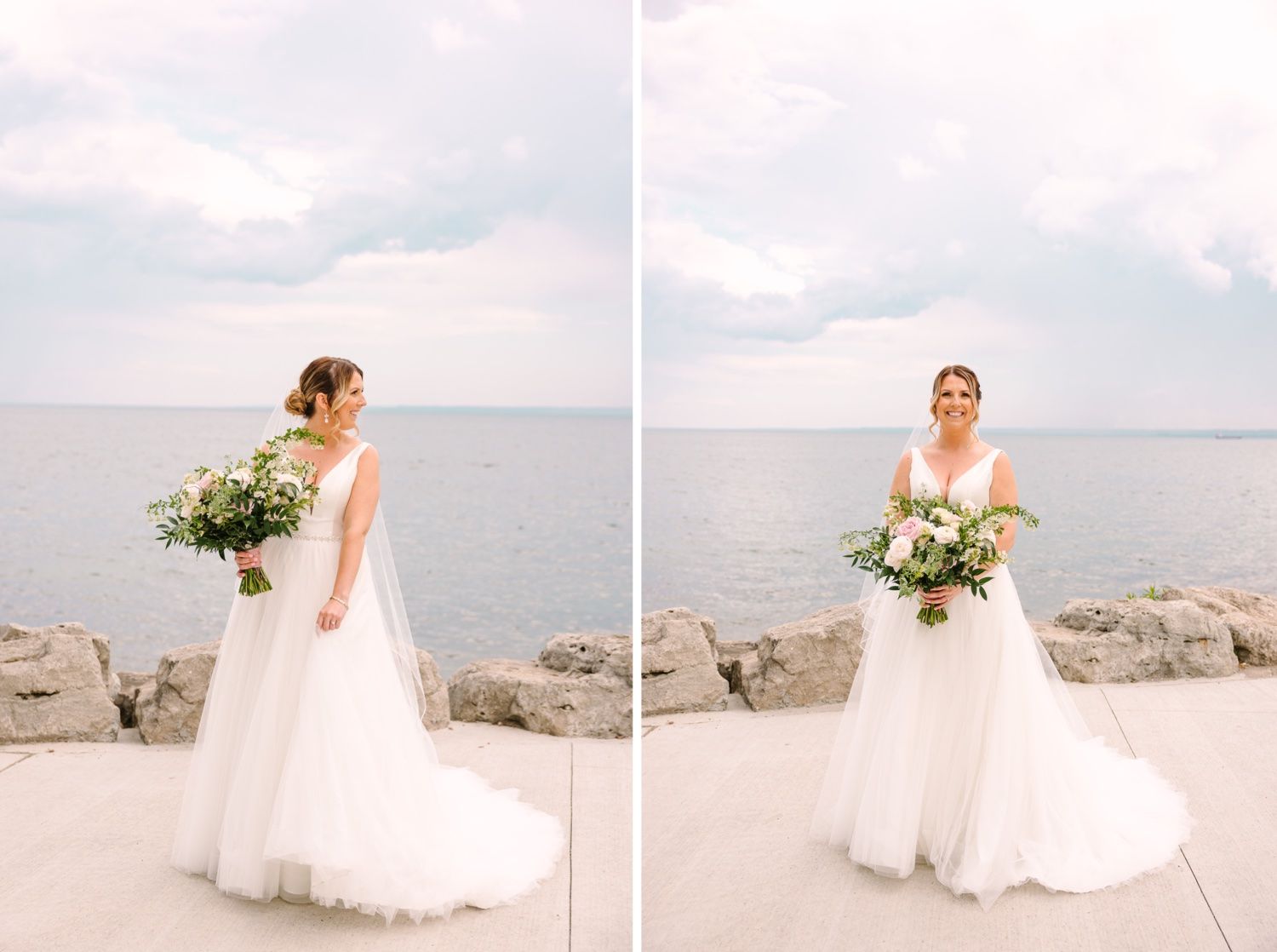 Bride in flowing white gown poses with bouquet against serene waterfront backdrop.