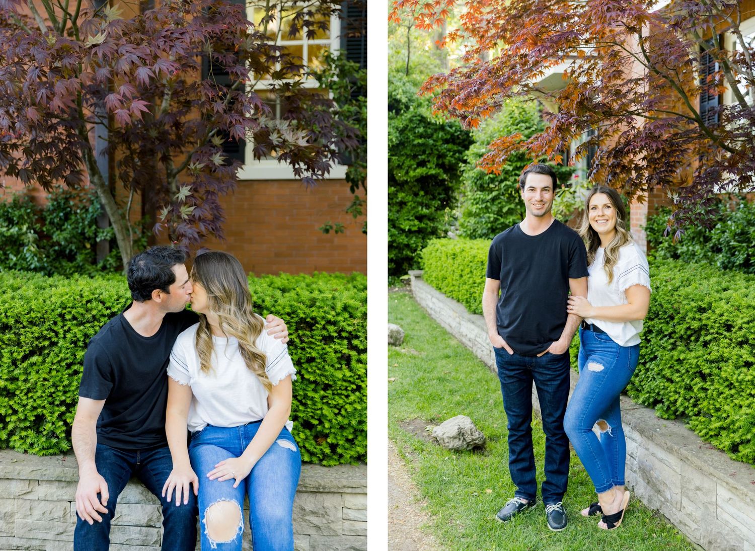 A couple poses both sitting and standing by a stone wall with Japanese maple tree.