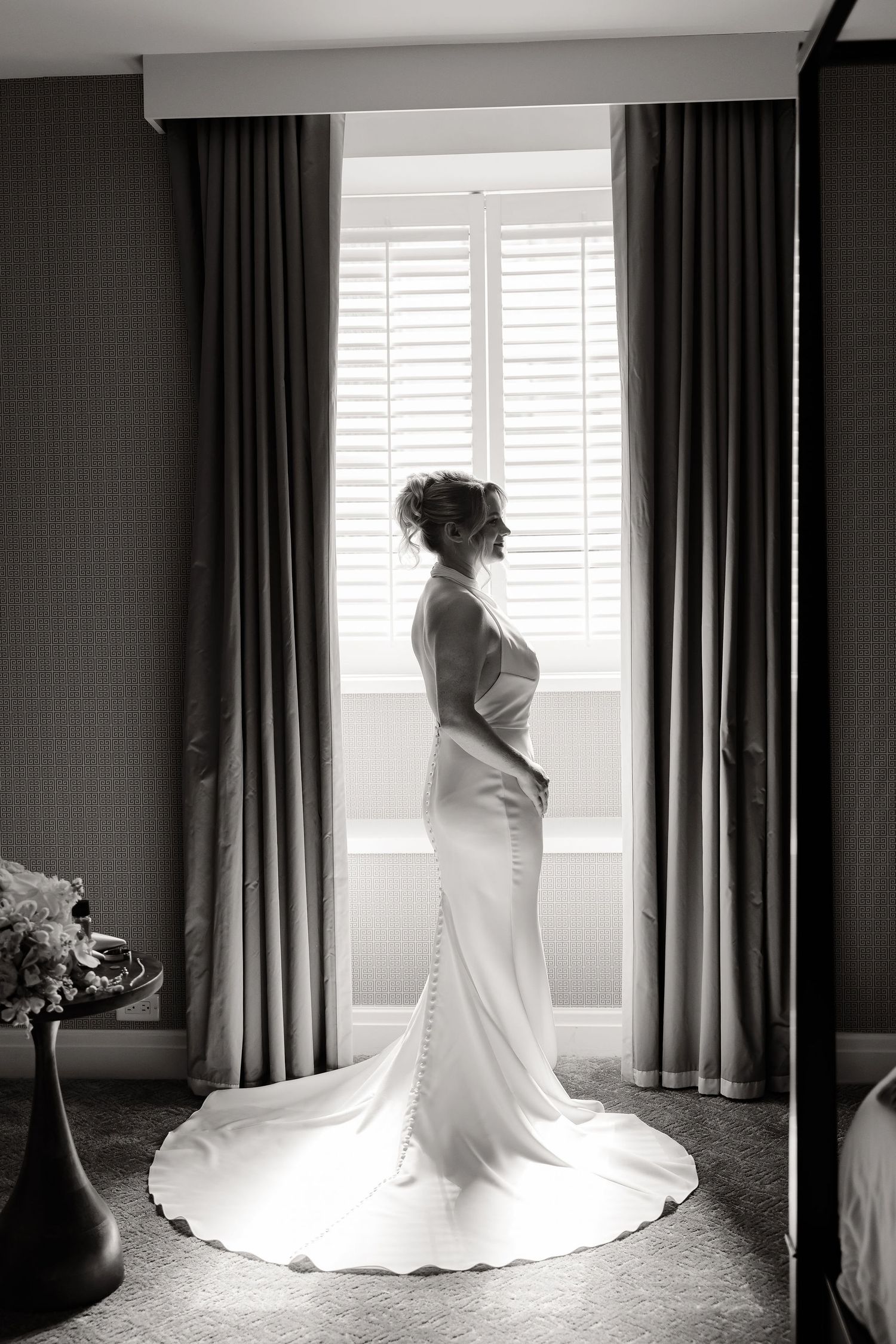 Wedding dress silhouette series showing dramatic train movement in black and white photography.