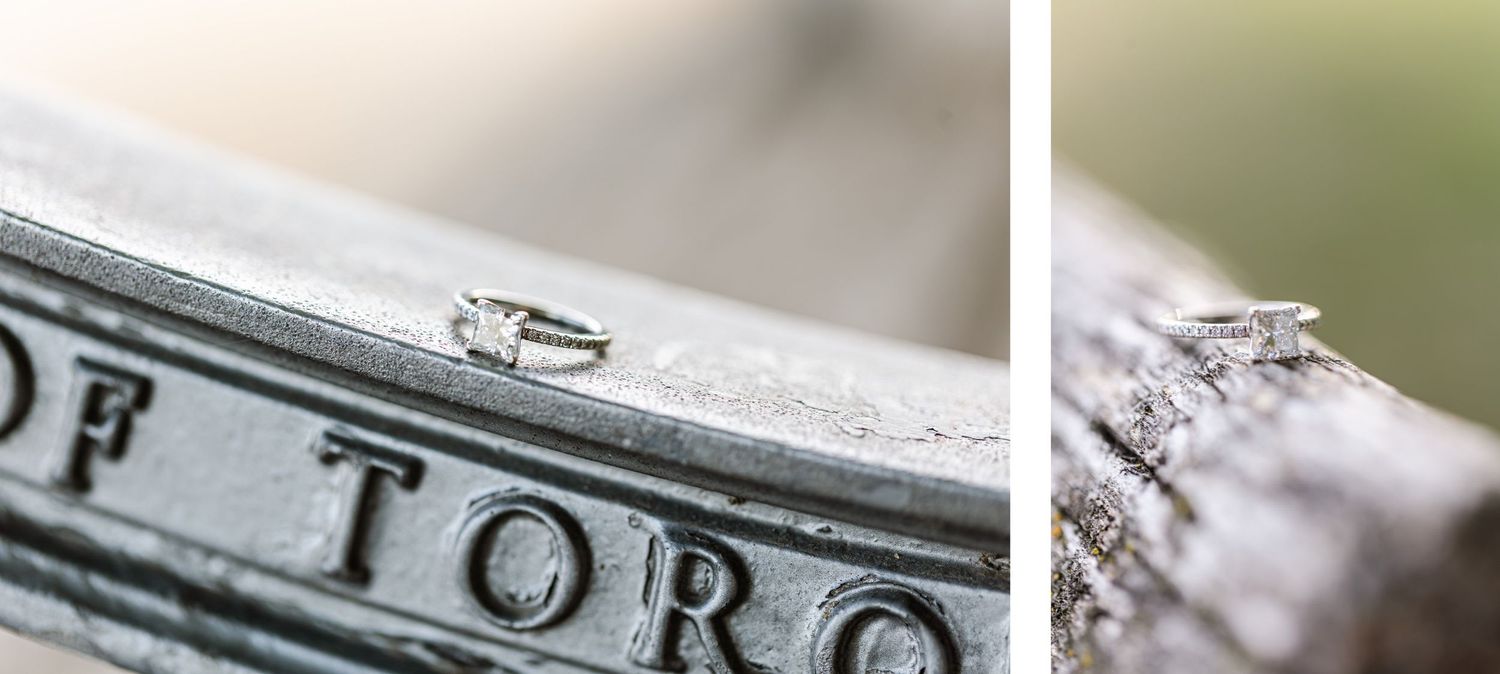 Close-up photograph of engagement ring on rustic metal surface.