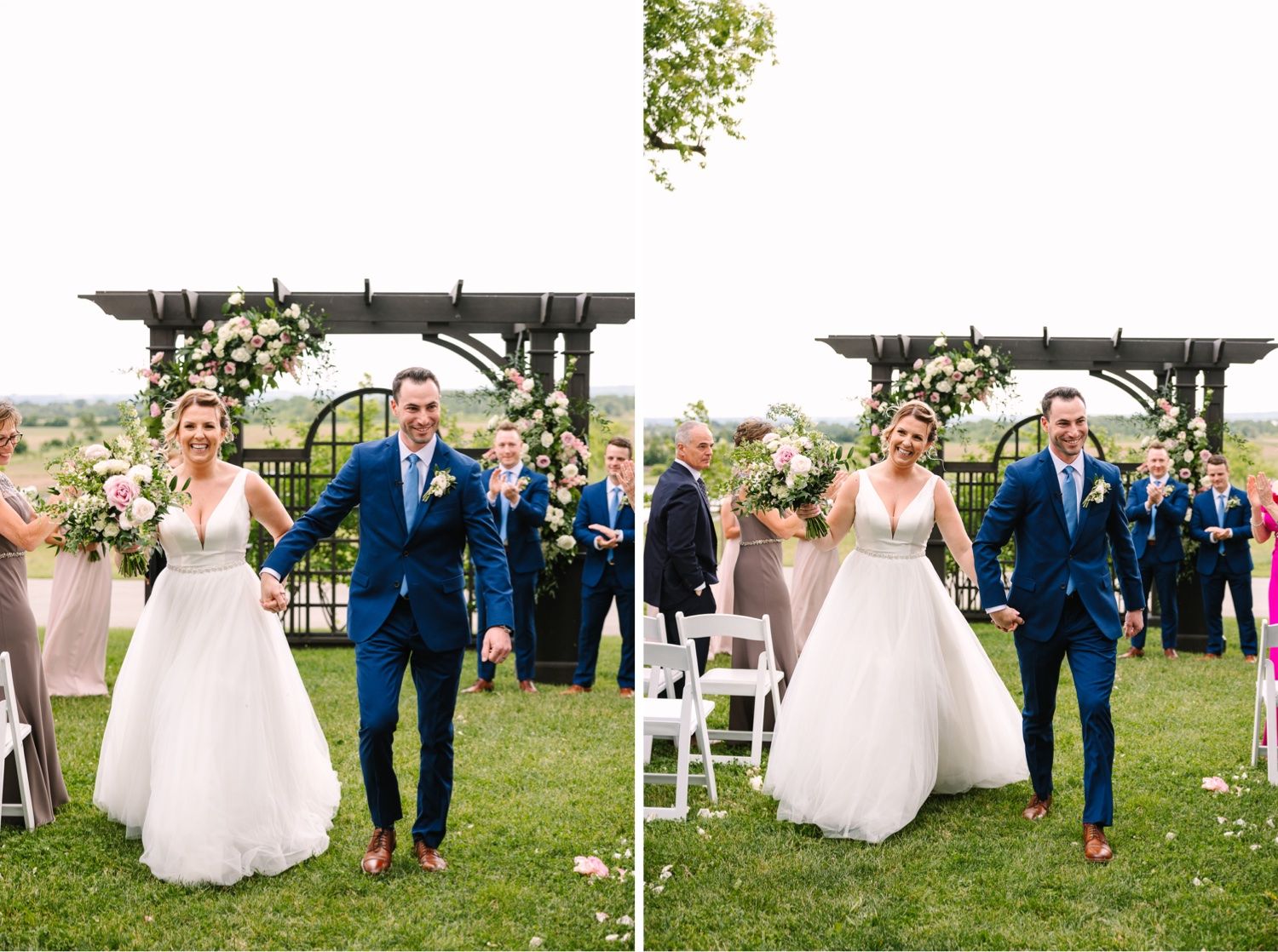 Couple celebrates with guests under rustic pergola at outdoor wedding ceremony with white chairs and floral decor.
