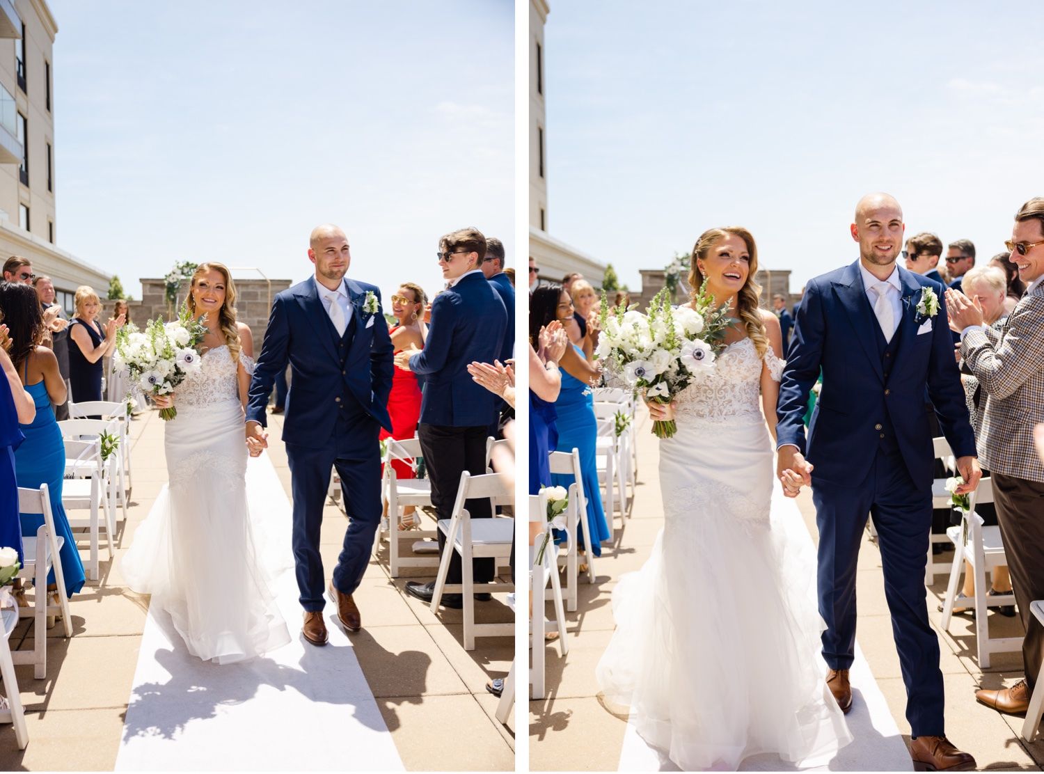 Couple walks down aisle at outdoor rooftop wedding ceremony with guests seated on white chairs.