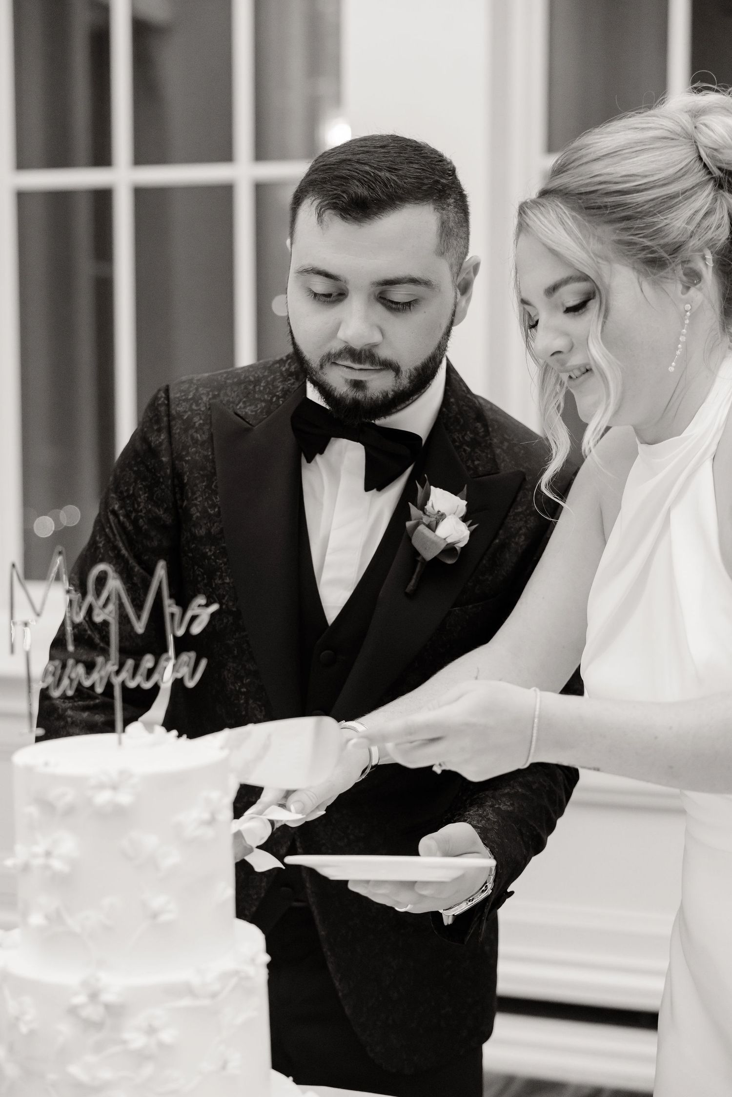 Couple sharing an intimate moment during their first dance at an elegant wedding reception.