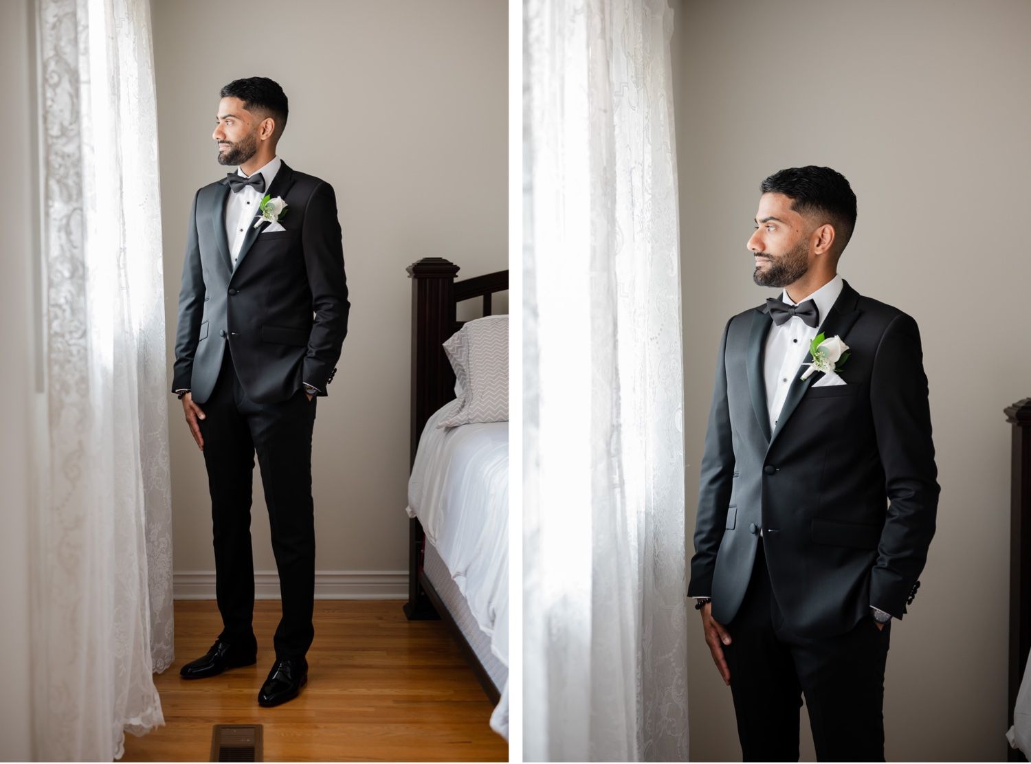 Stylish groom in black tuxedo poses by window for wedding portraits in natural light.