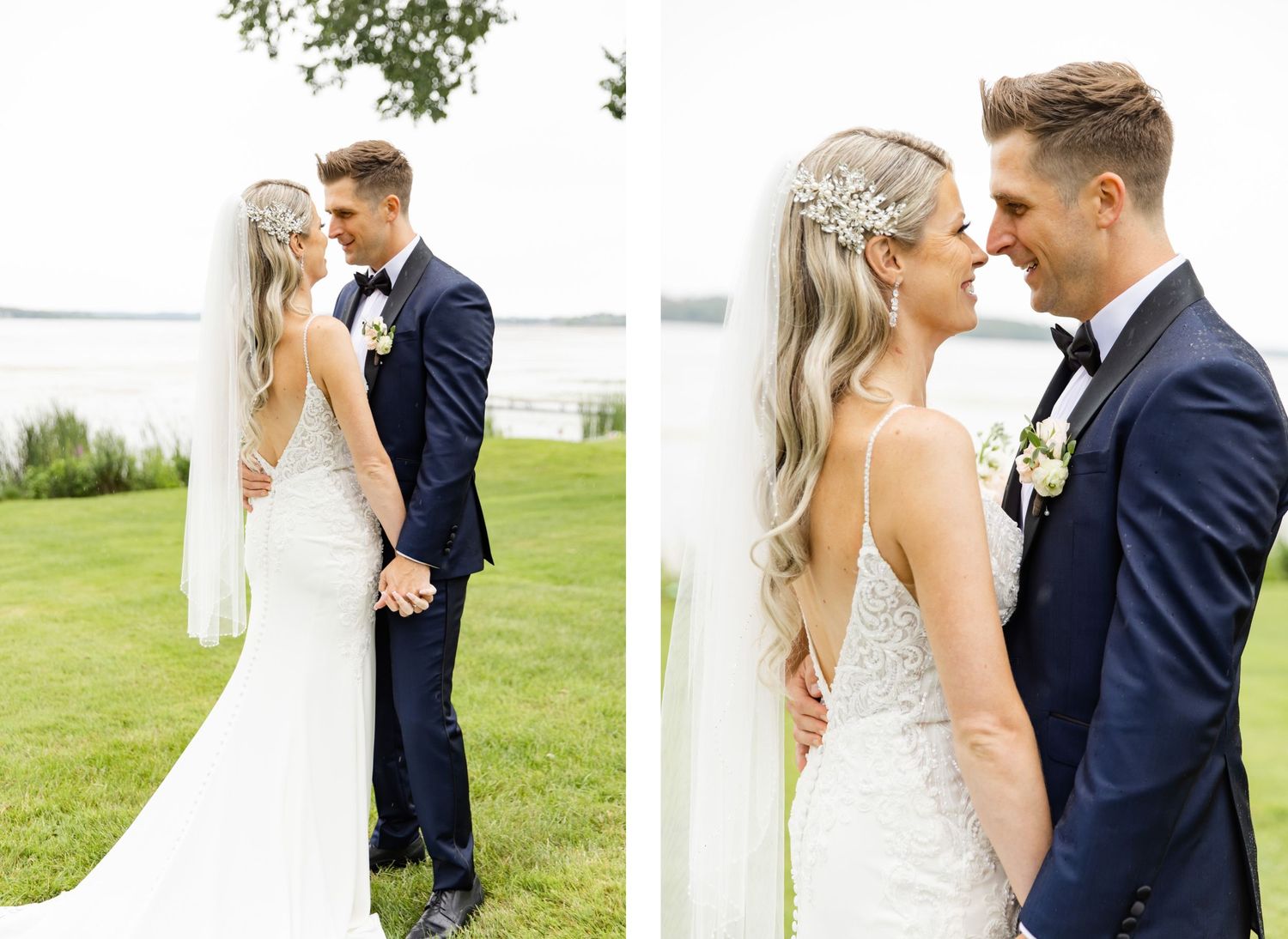 Romantic wedding portrait on waterfront lawn with couple in elegant navy suit and white lace gown.