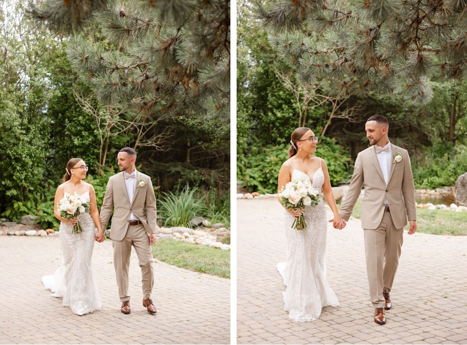 Wedding couple walking hand in hand along garden path surrounded by pine trees.