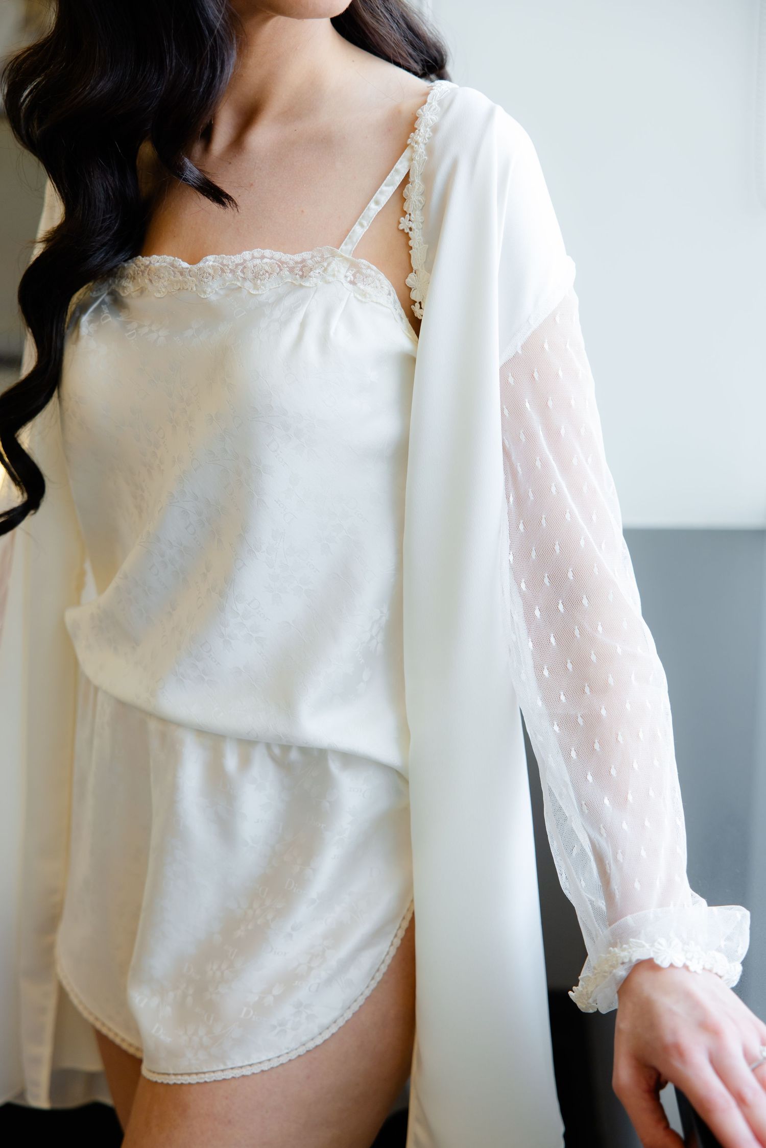 White lace-trimmed loungewear set with sheer dotted sleeves.