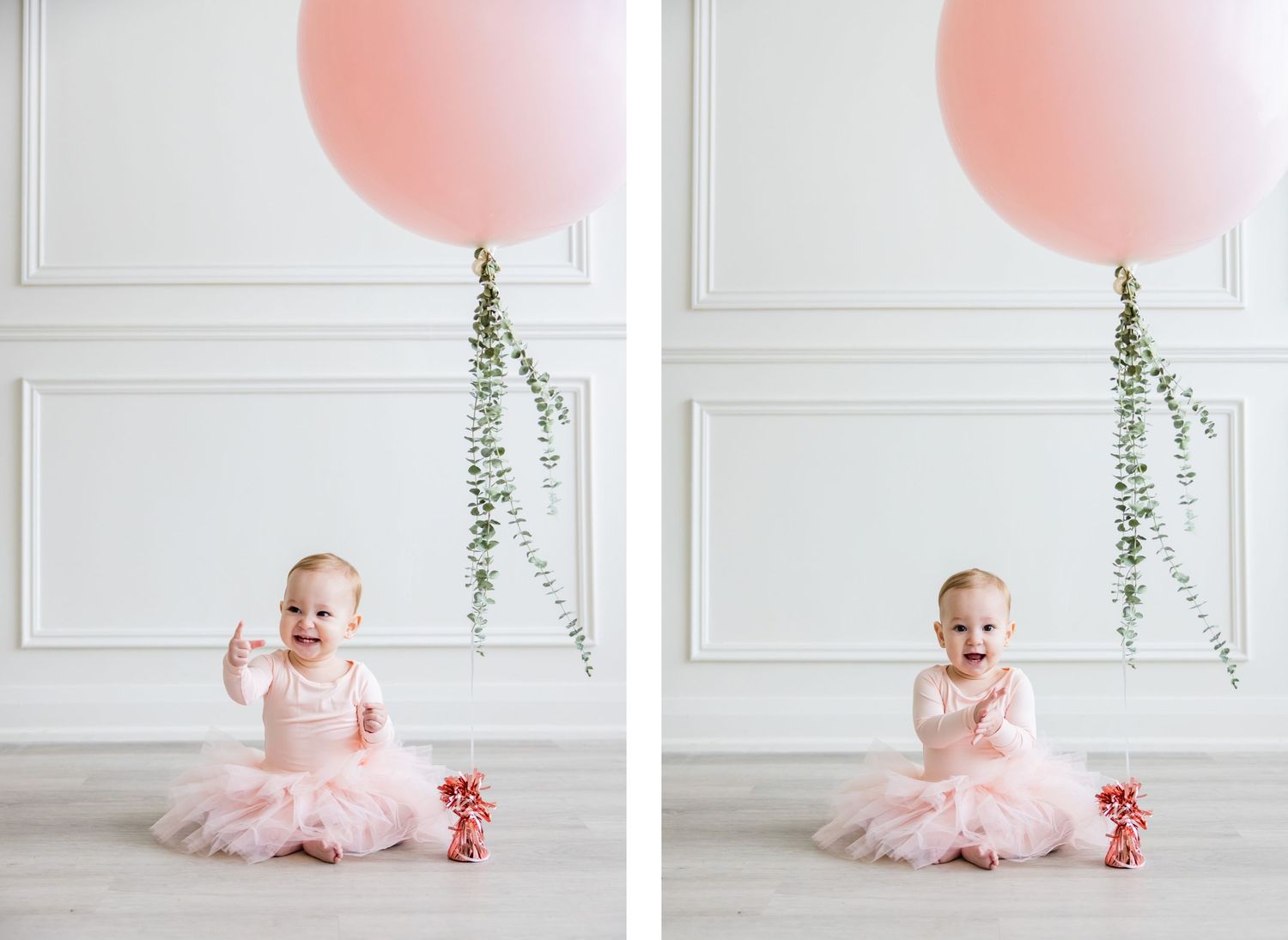 Pink tulle outfit against white wall with large pink balloon and hanging greenery.