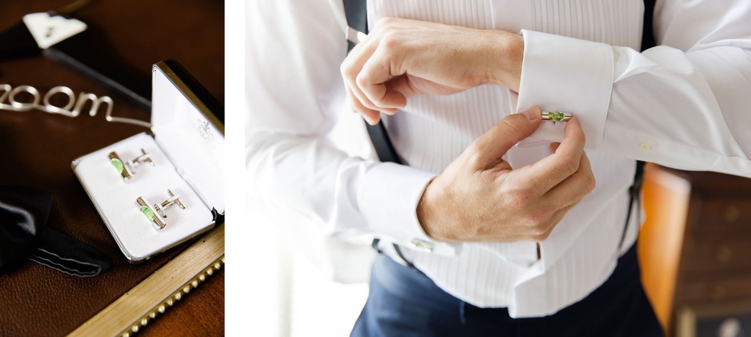 Close-up detail of hands buttoning a white dress shirt cuff.