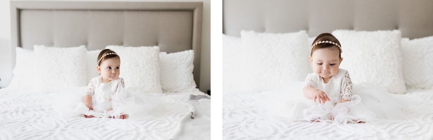 Baby in white dress sitting on white bed with pillows in two similar poses.