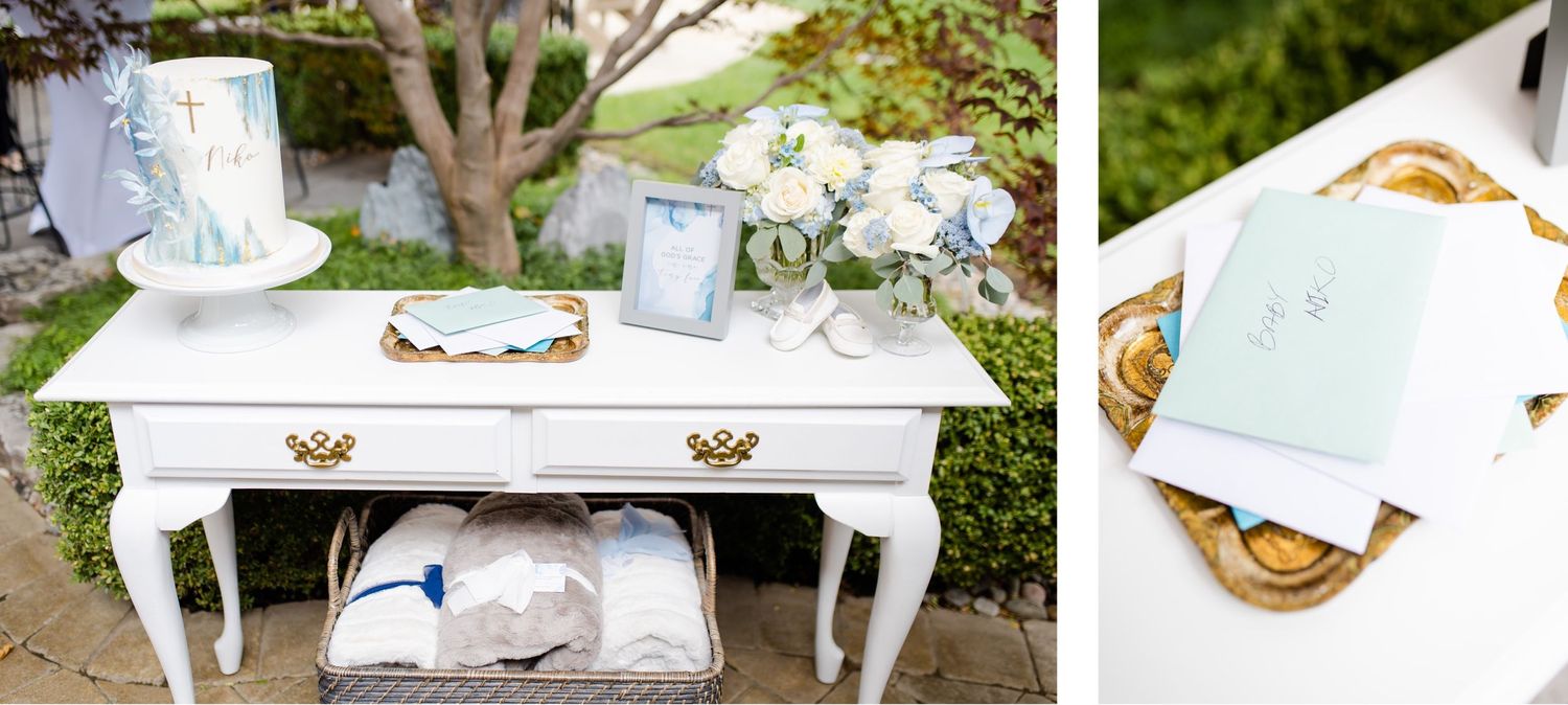Vintage white desk display with baptism decor in soft blue and white tones.