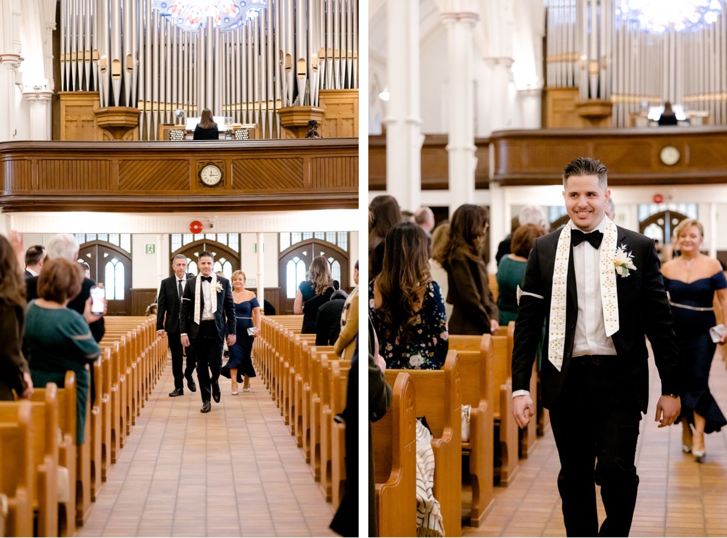 Wedding procession walking down church aisle with large pipe organ in background.